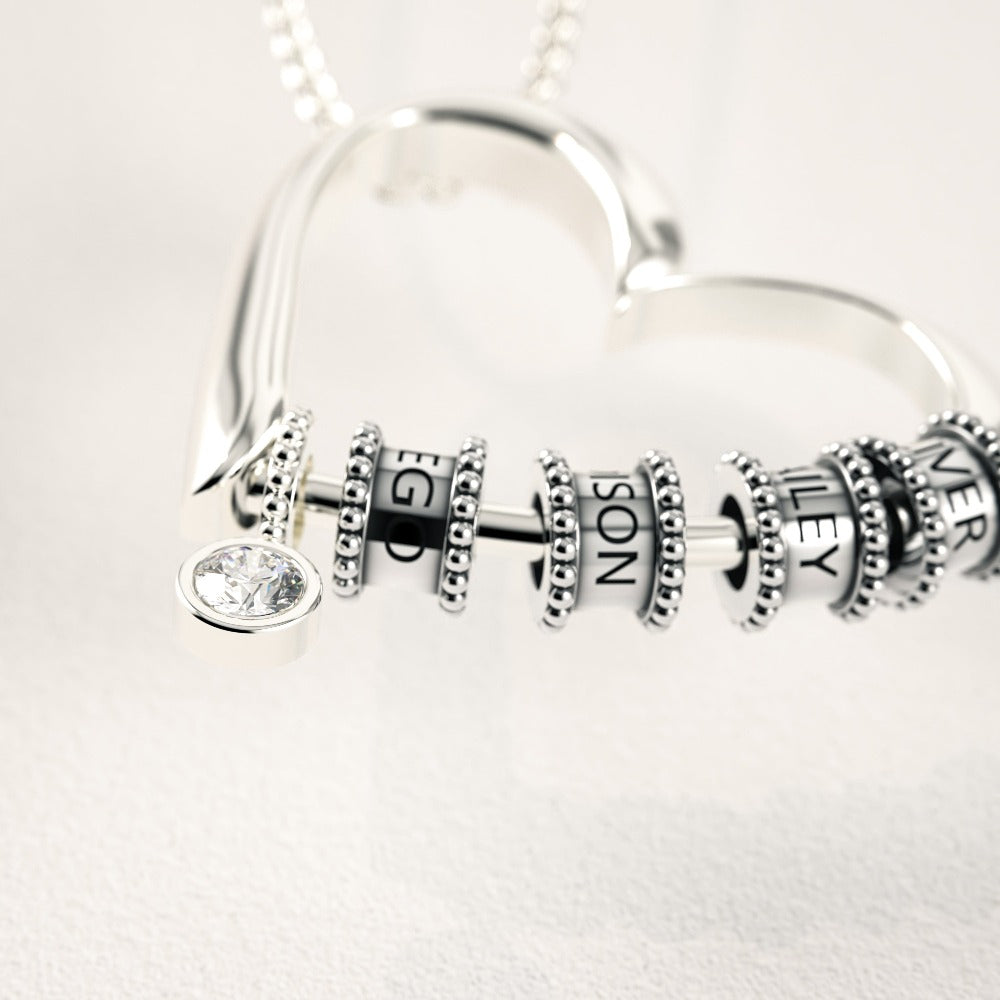 Herzkette mit gravierten Perlen und Diamant