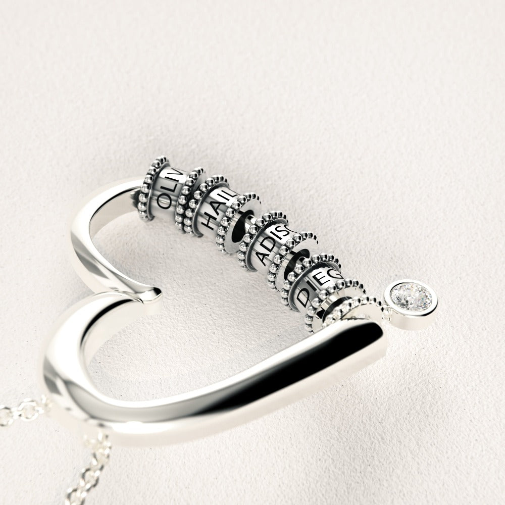 Herzkette mit gravierten Perlen und Diamant