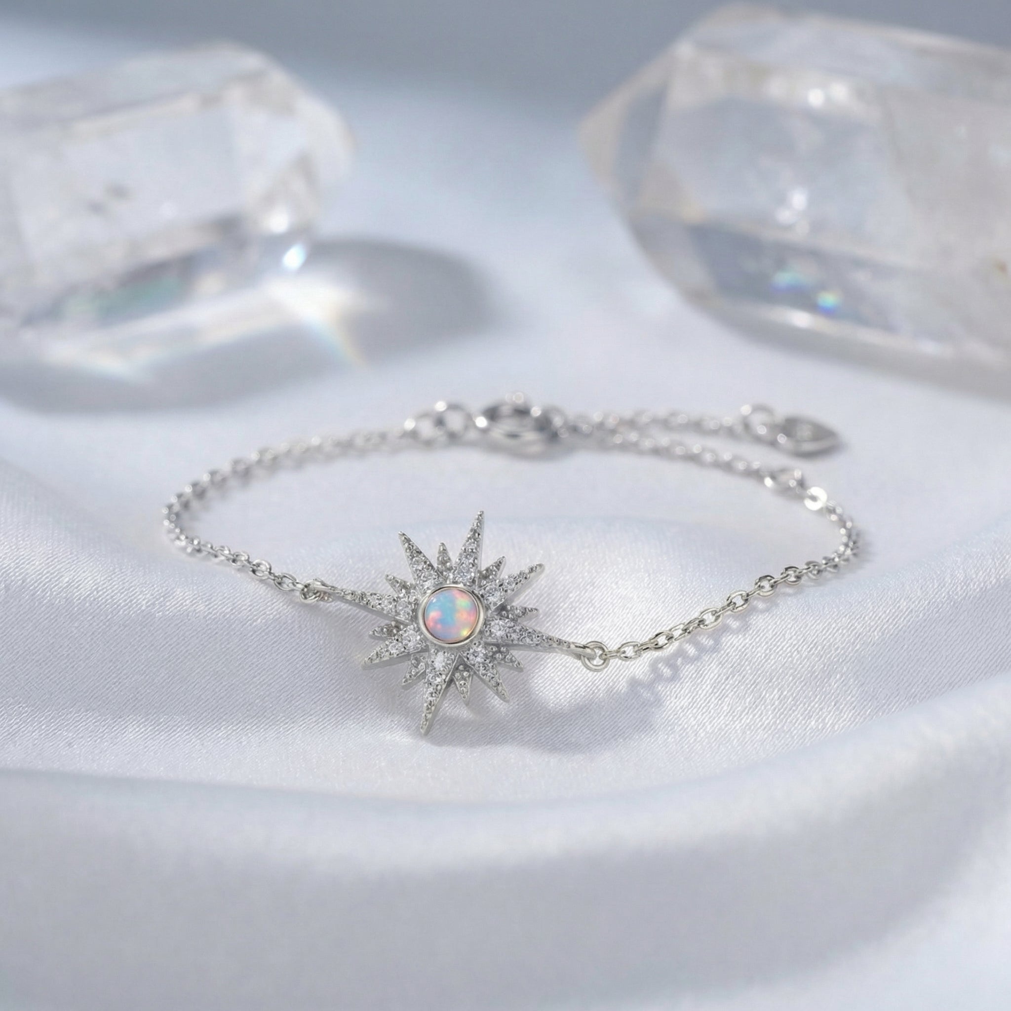 A solid white gold tennis bracelet with natural white opals.