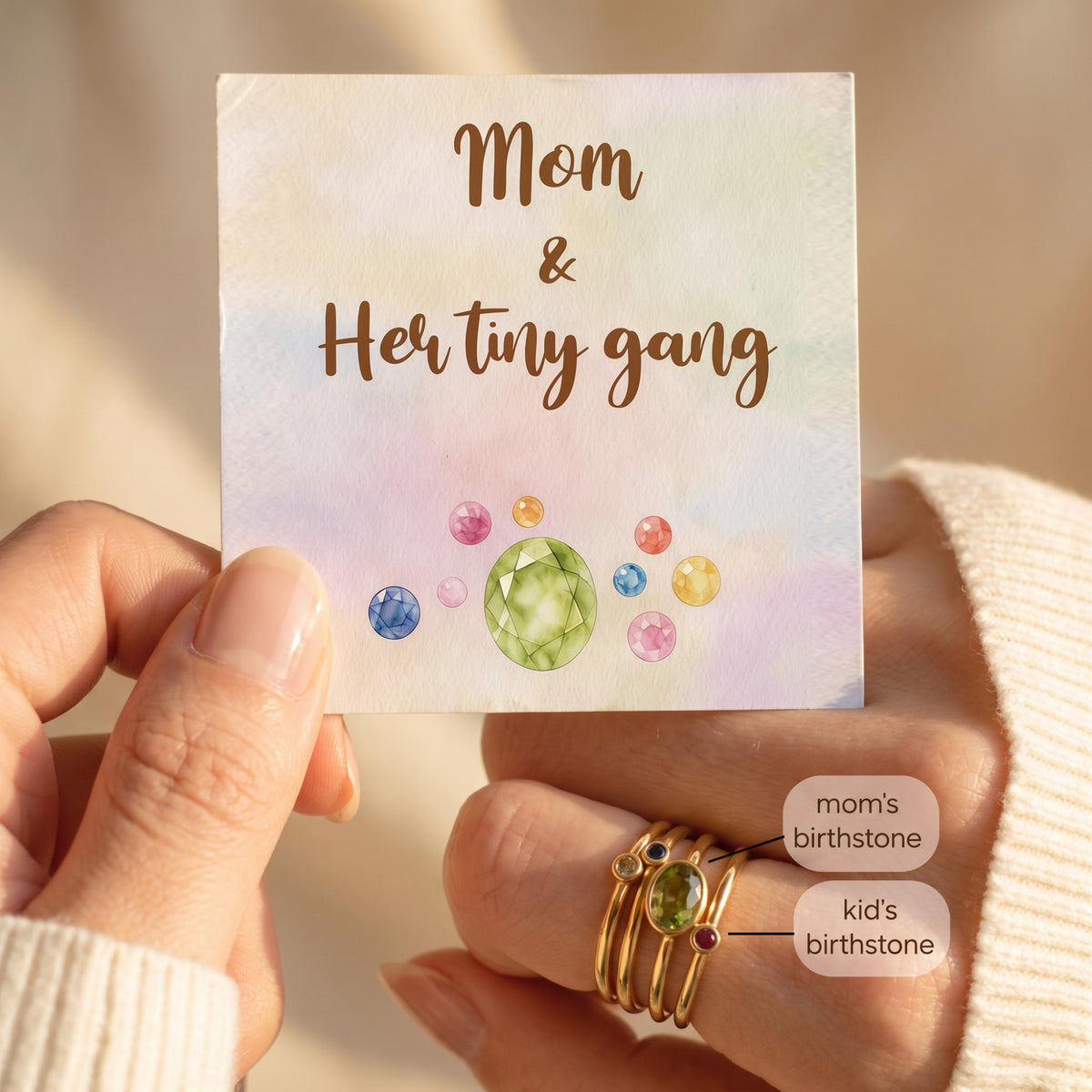 Gold-tone family stacking rings worn with Mom & Her Tiny Gang card