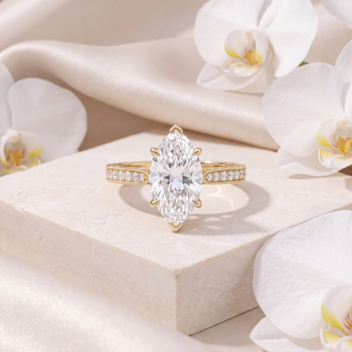 Front view of a yellow gold marquise-cut moissanite engagement ring featuring a milgrain accent band.