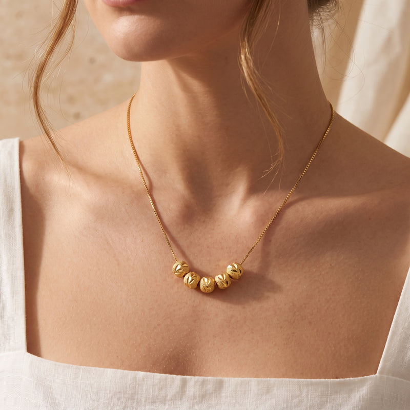 The Carved Bead Station Necklace