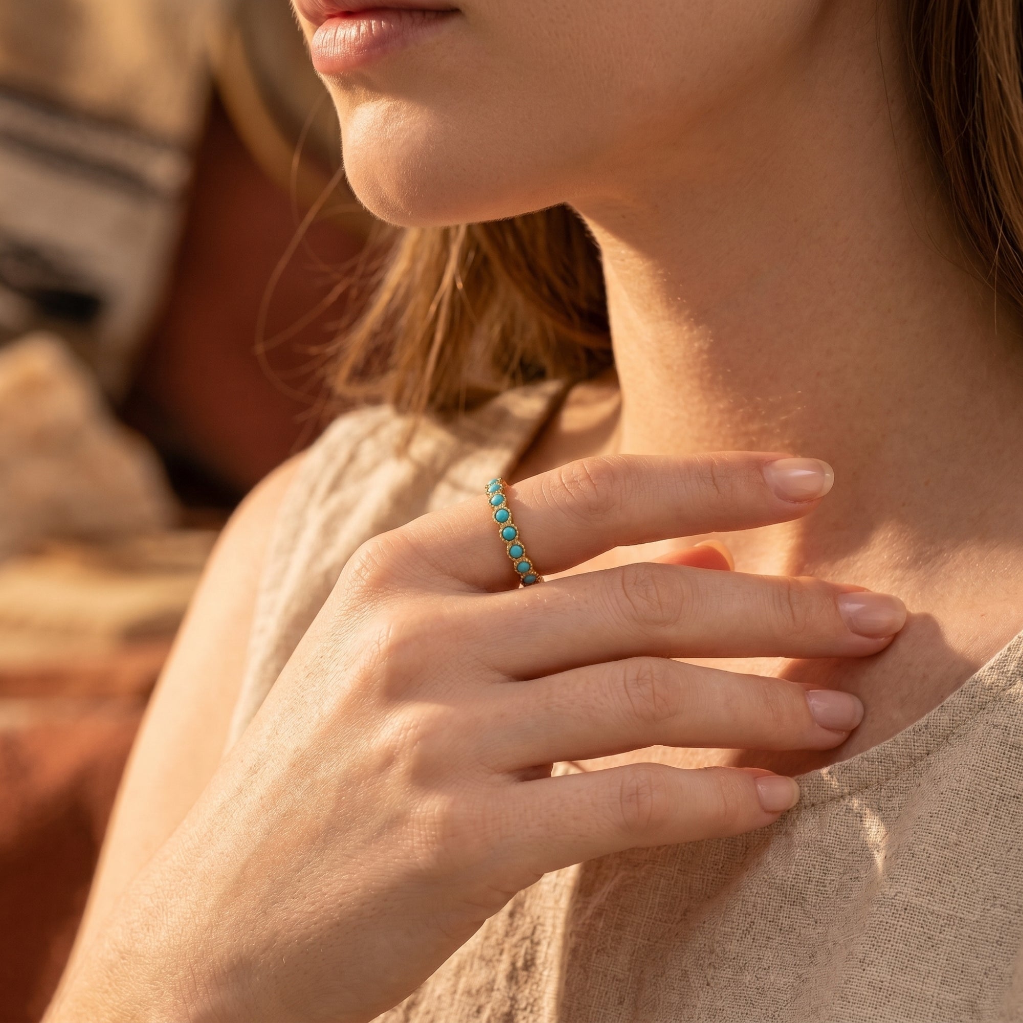 Model wearing the gold Zia turquoise eternity ring for a minimalist Southwestern-inspired look.