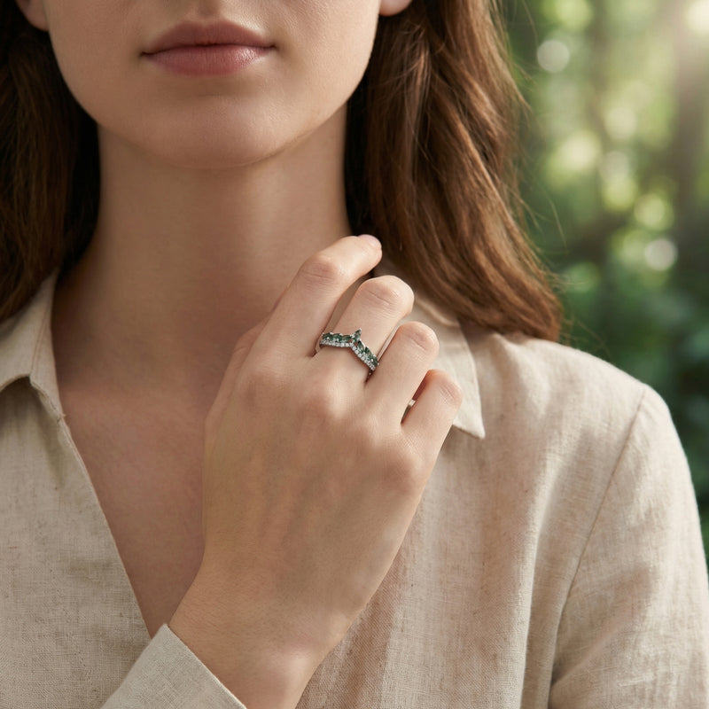 Model wearing the sterling silver moss agate wave ring on her finger, paired with a neutral linen shirt.