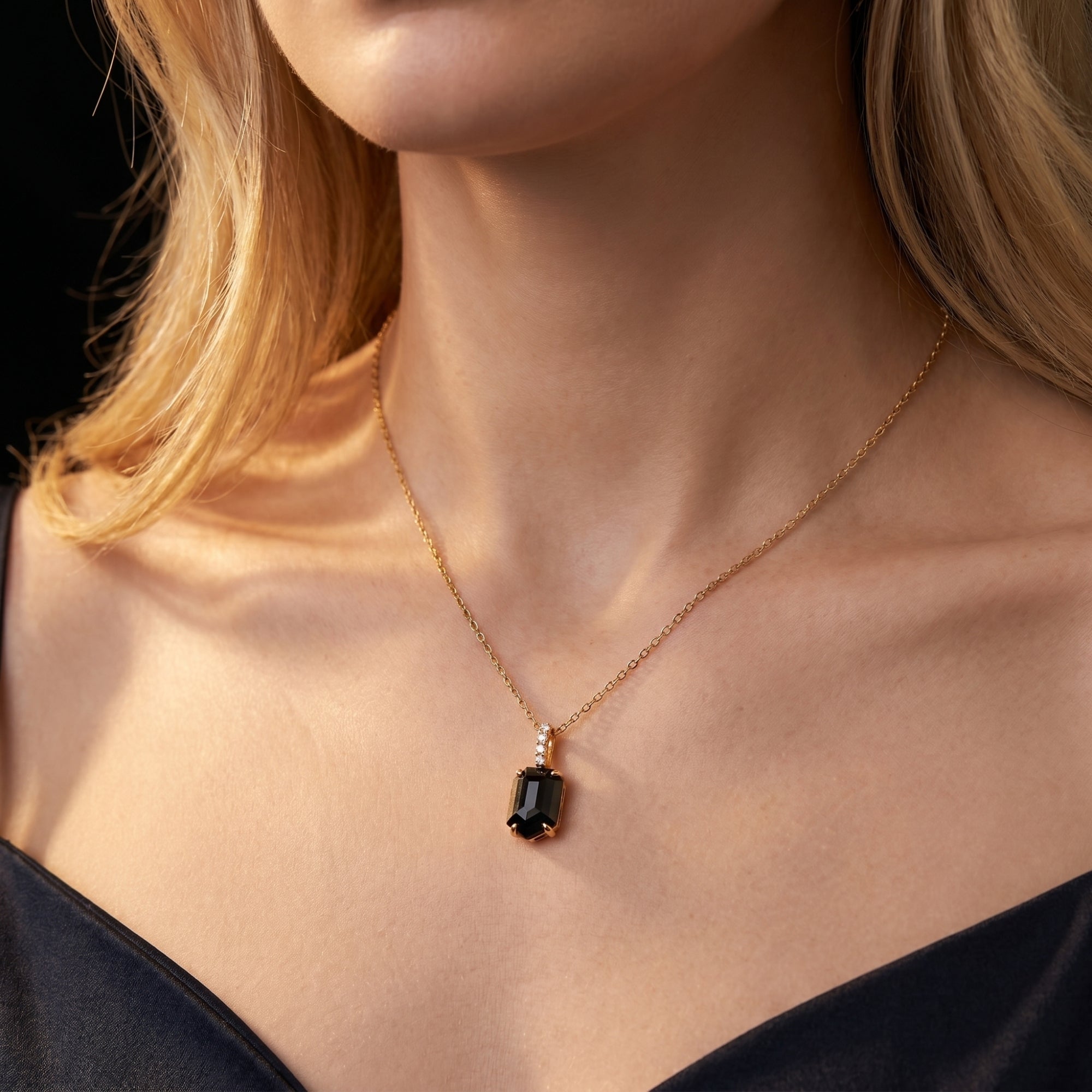 Noctis square-cut black onyx pendant necklace in 18K gold plated silver worn by a model.