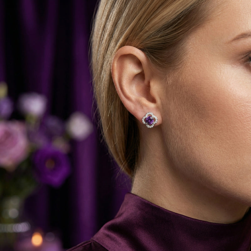 Model wearing a round cut natural amethyst stud earring in S925 sterling silver on her earlobe.