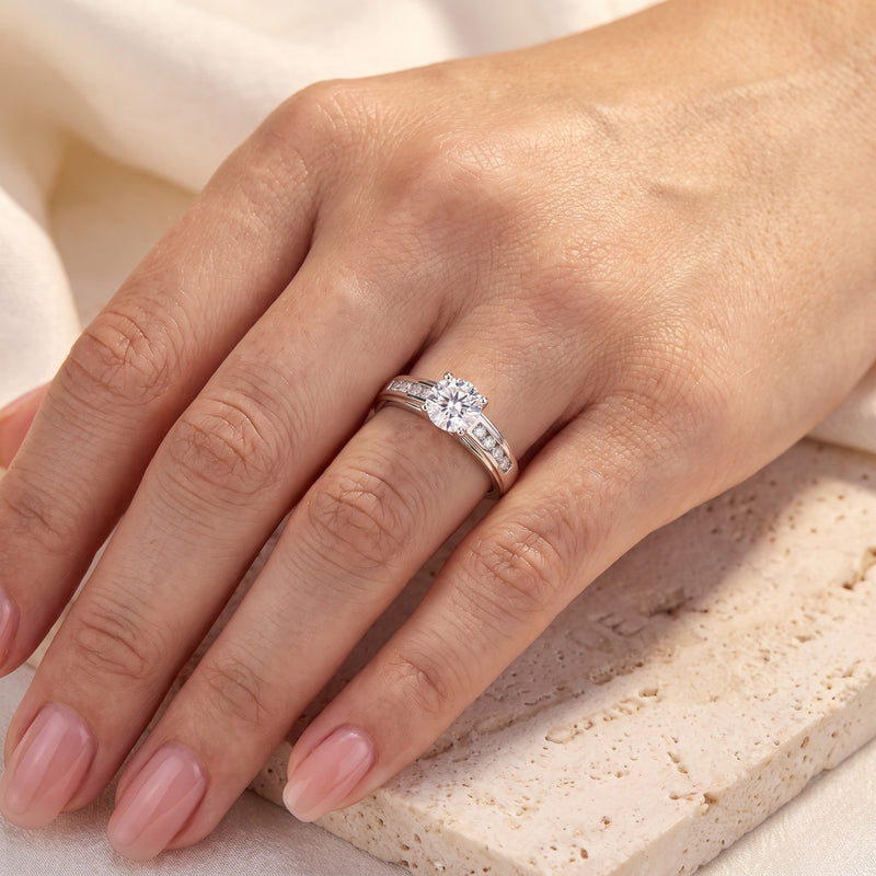 S925 sterling silver crossover cathedral ring with a round simulated diamond worn on a woman's hand.