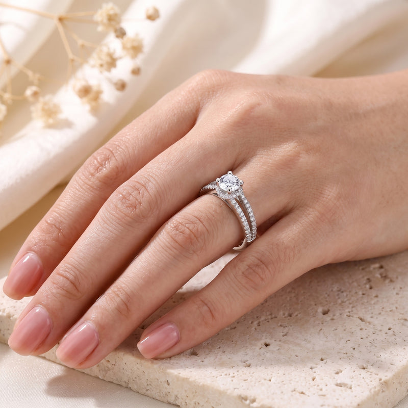 S925 sterling silver split shank ring with round cubic zirconia worn on a model's hand.
