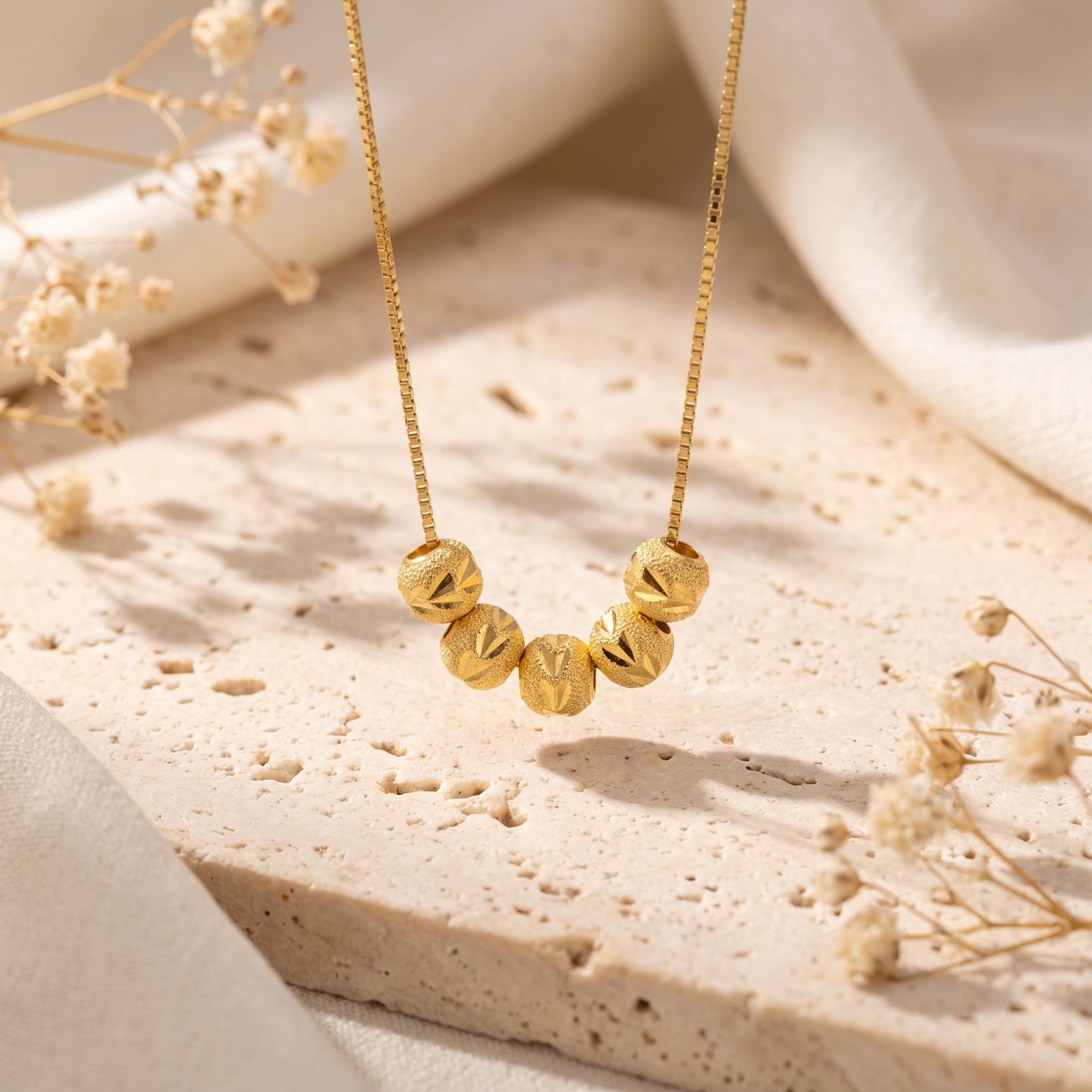 The Carved Bead Station Necklace