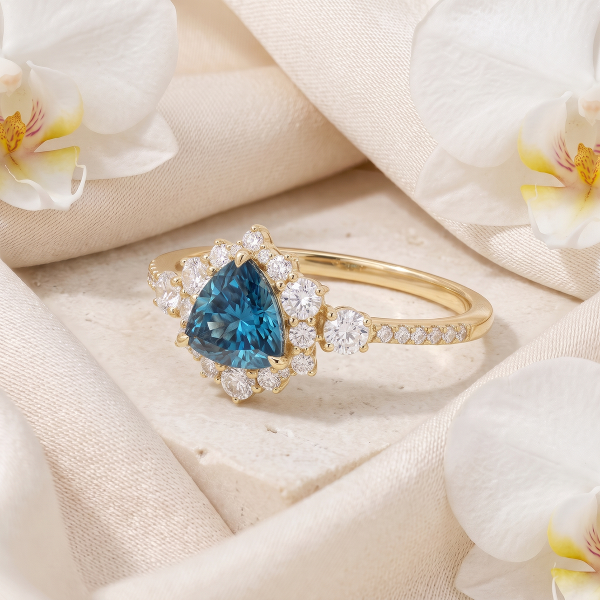 Angled side view of a yellow gold ring featuring a trillion-cut blue moissanite stone in a halo setting.