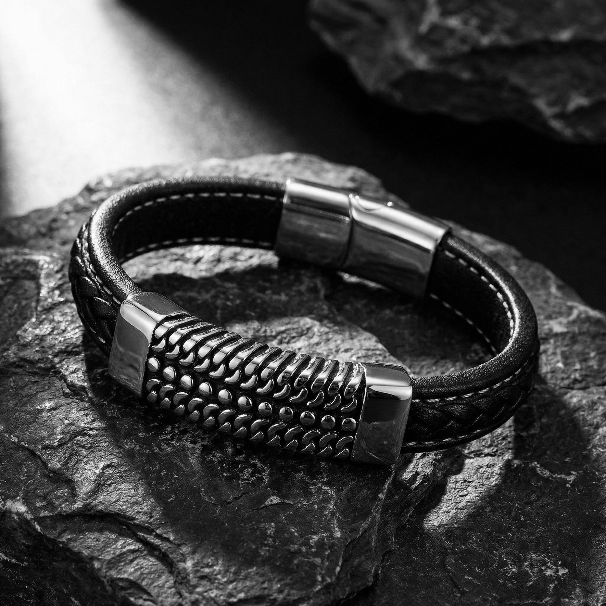 Close-up of the Kinetic Bracelet showing the rugged chain-link texture of the silver stainless steel plate.