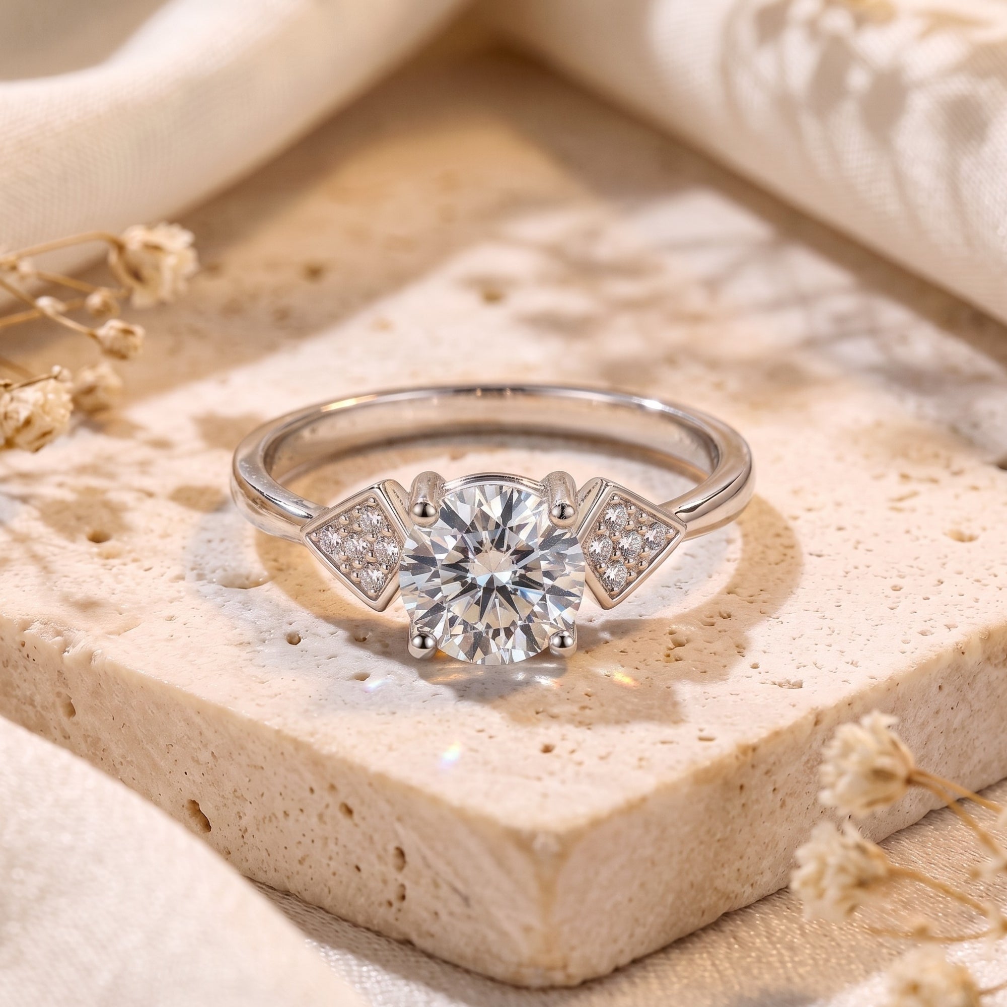 Close-up of S925 silver Trinity ring with round brilliant stone and triangle accents.