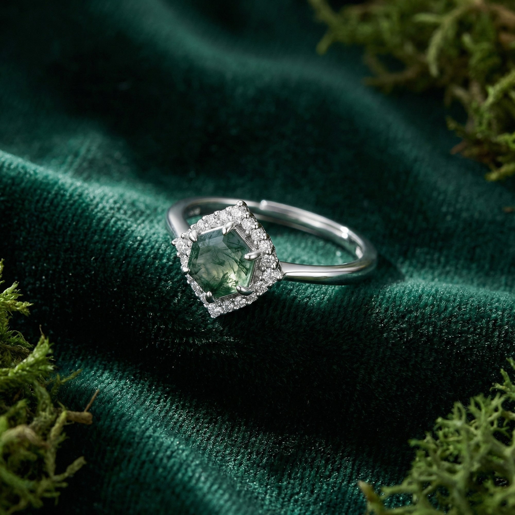 Close-up of a hexagonal cut natural moss agate ring with a diamond halo and S925 sterling silver band.