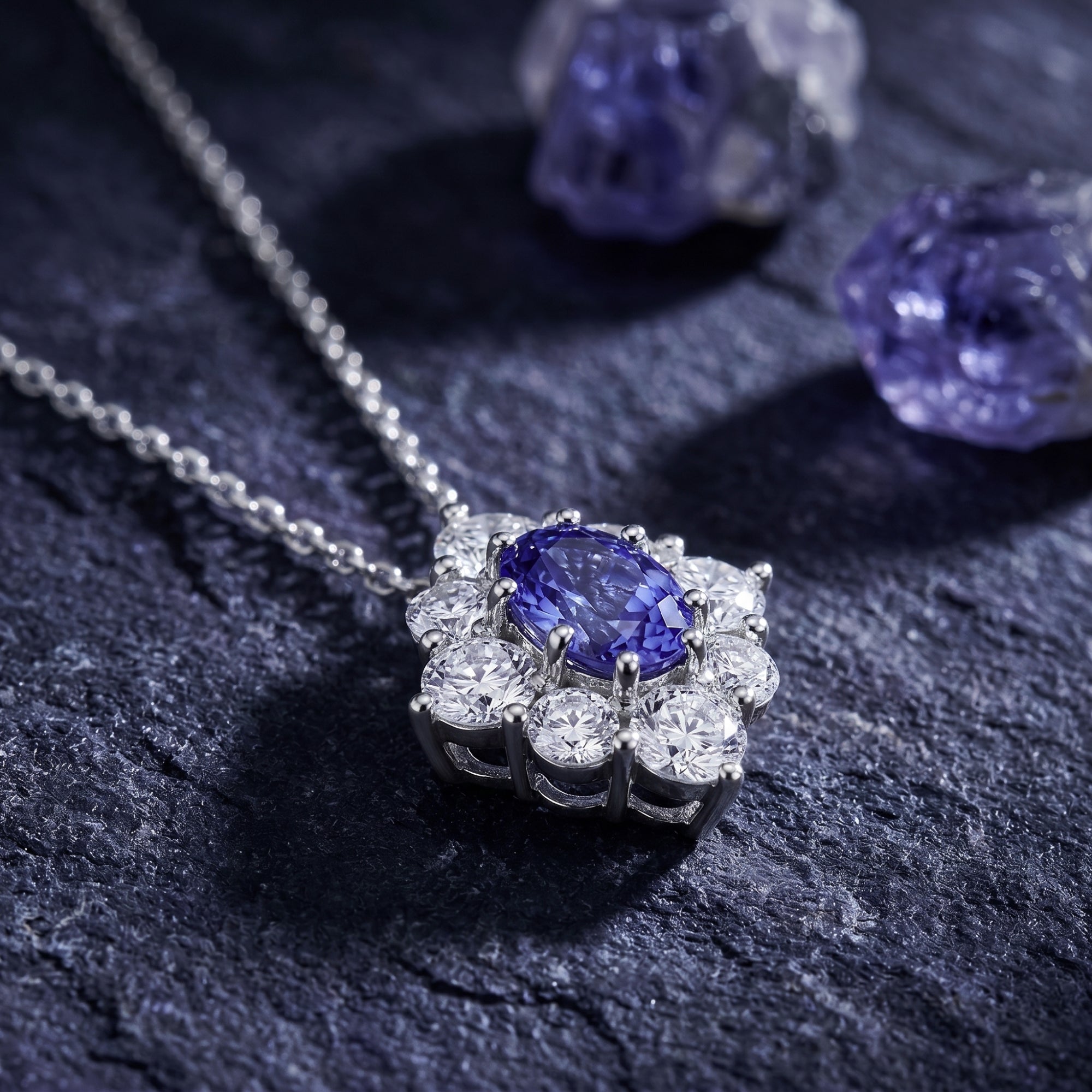 Macro view of the oval cut natural tanzanite and halo setting on a white gold pendant necklace.