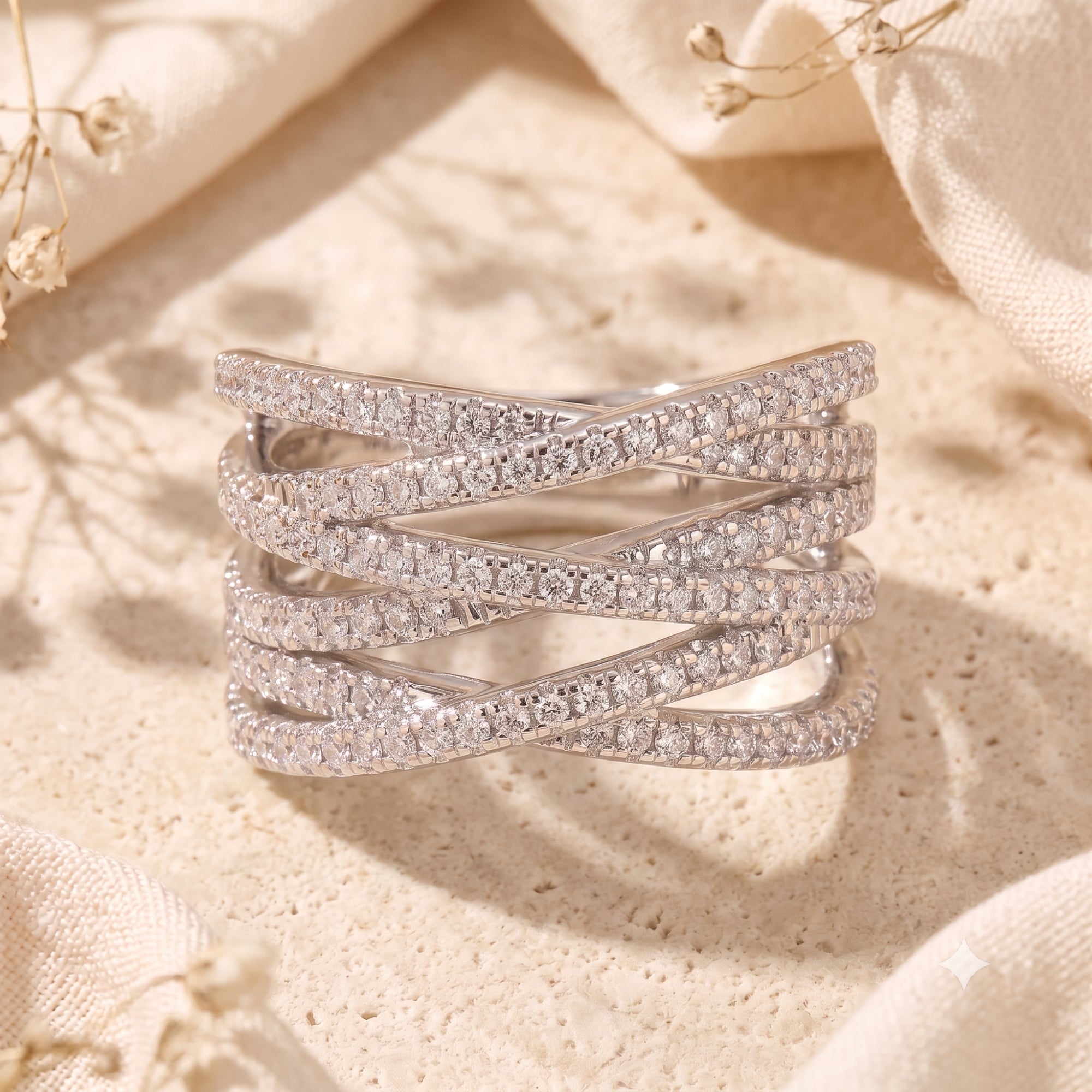Macro view of the Nexus crossover ring's pavé simulated diamond rows in sterling silver.