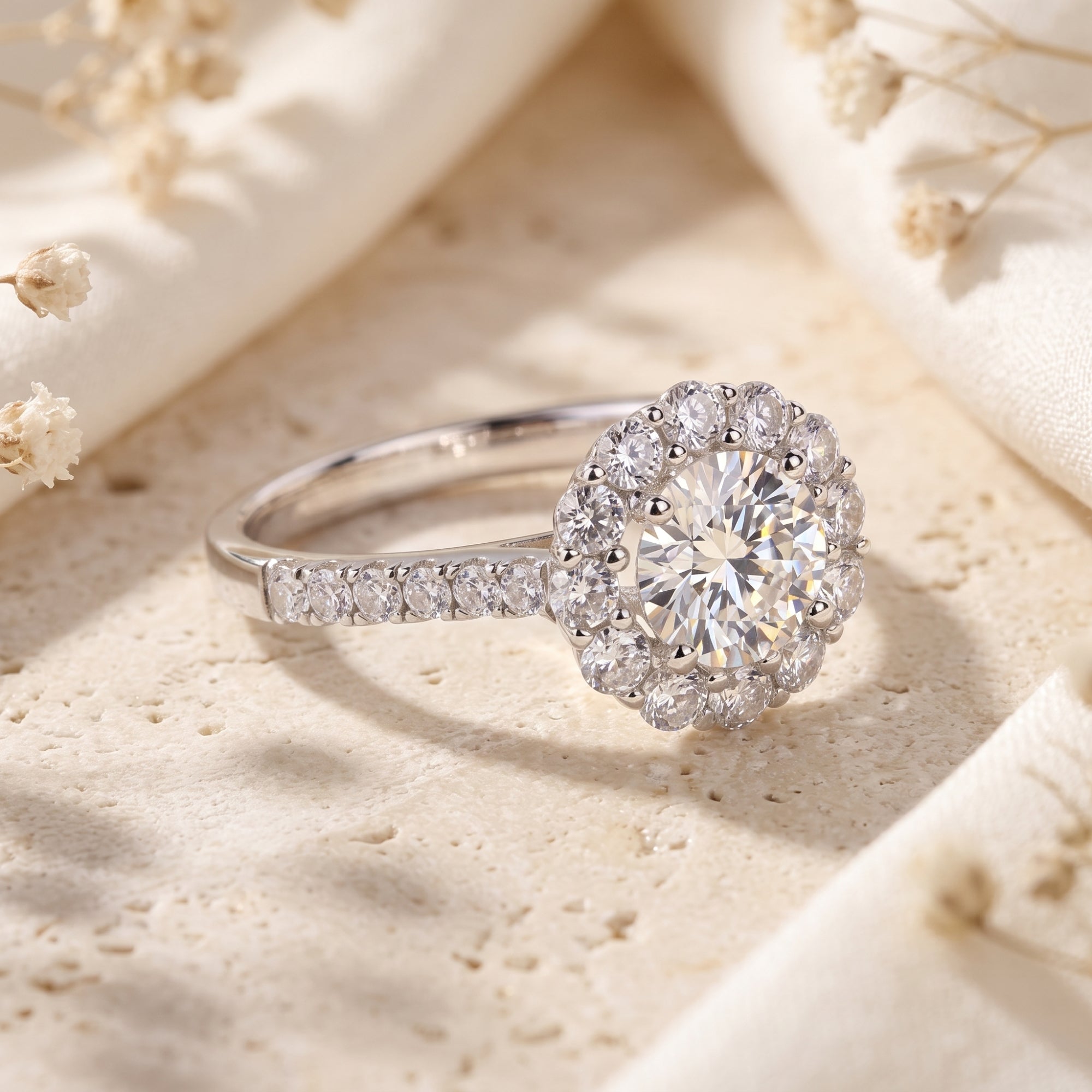 Angled view of the S925 silver floral halo promise ring showing the pavé band and meticulous floral setting.