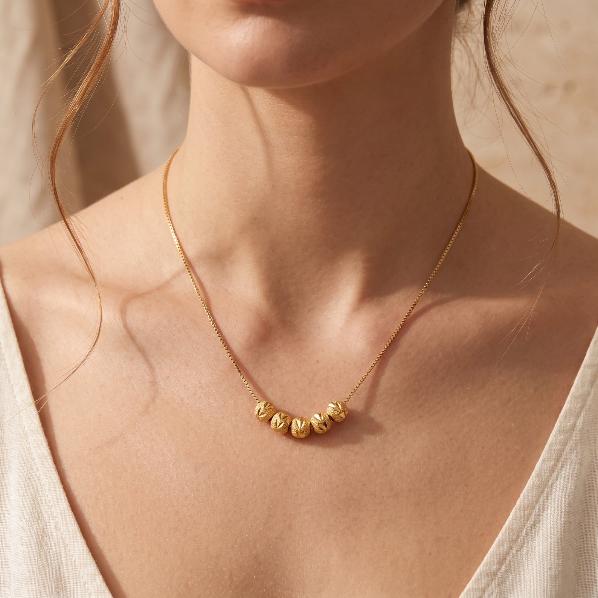 The Carved Bead Station Necklace