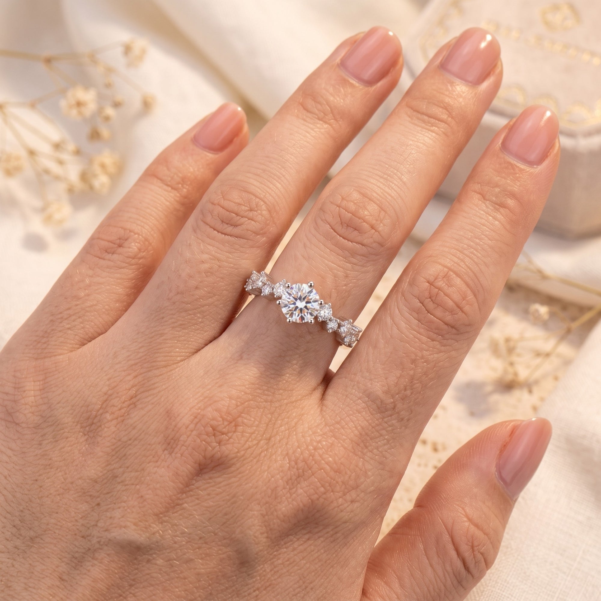 S925 silver Aura tiara ring with round cut stones on hand for scale.