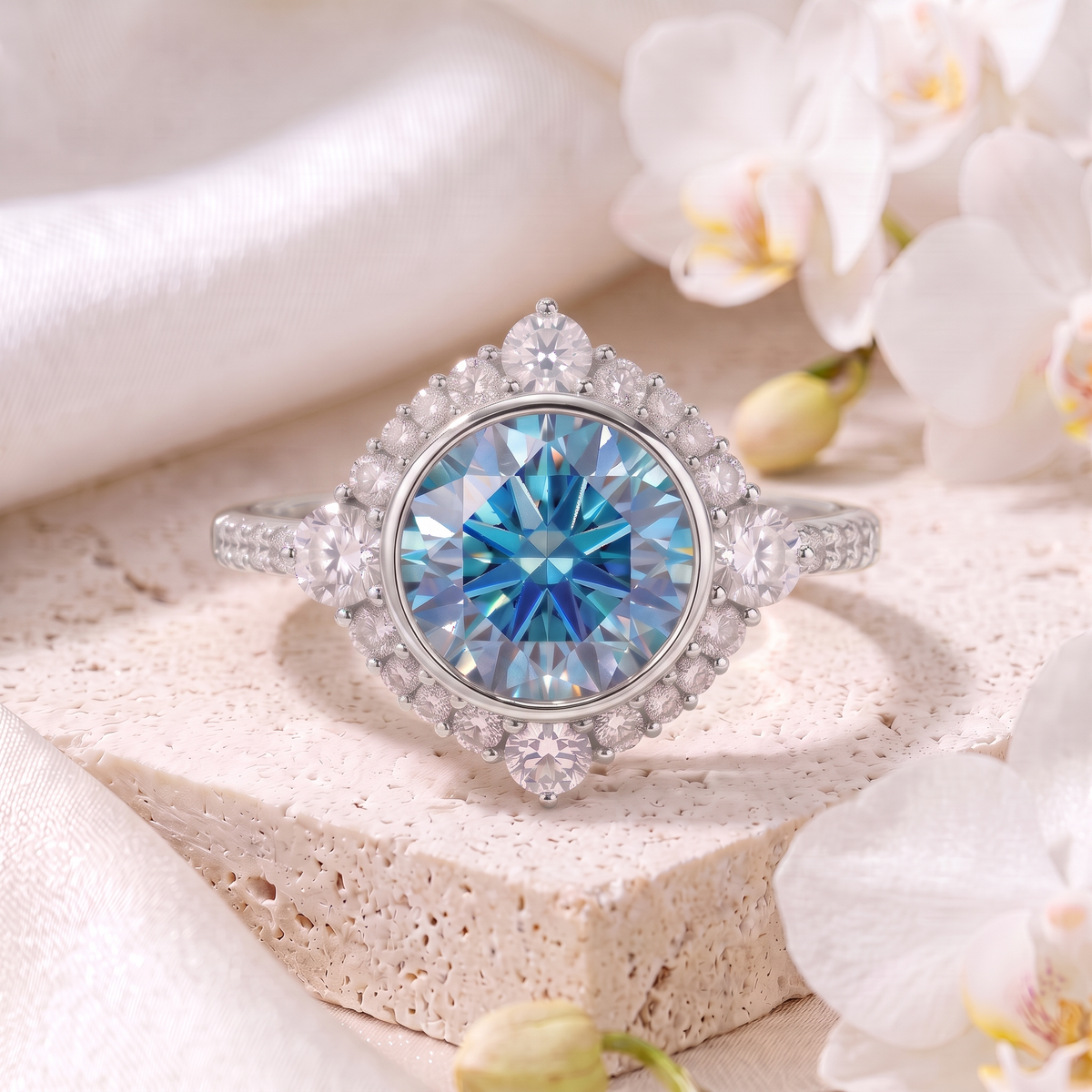 Front view of a white gold blue moissanite halo ring with sparkling side stones.