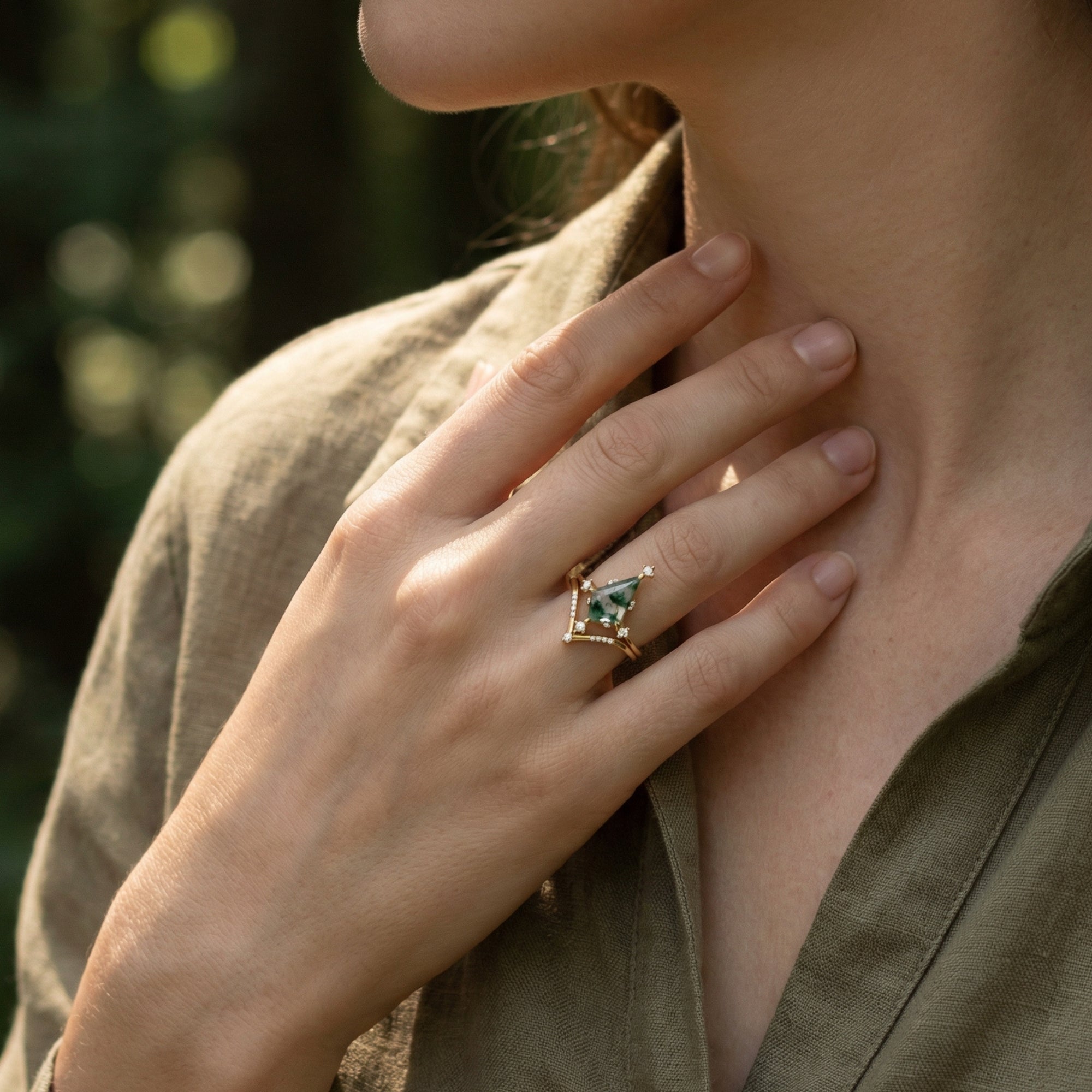 Close-up of the kite cut moss agate gold ring set worn on a hand, highlighting the chevron band.