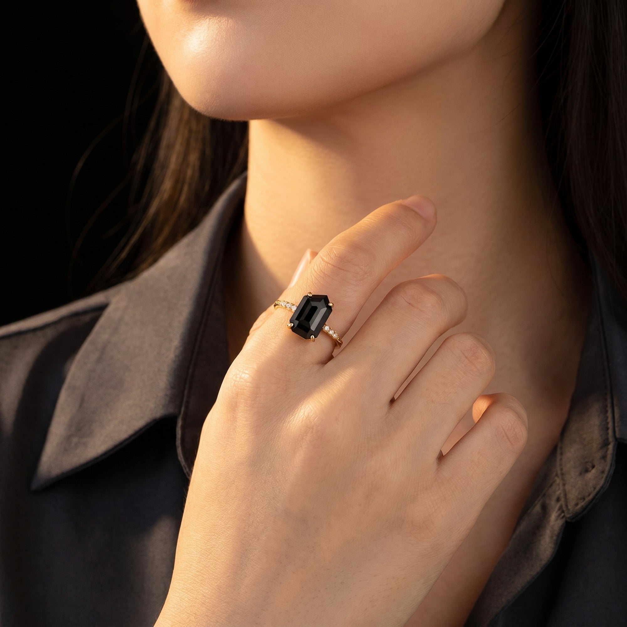Model wearing the Noctura natural onyx statement ring in 18K gold vermeil, showcasing its size and fit.