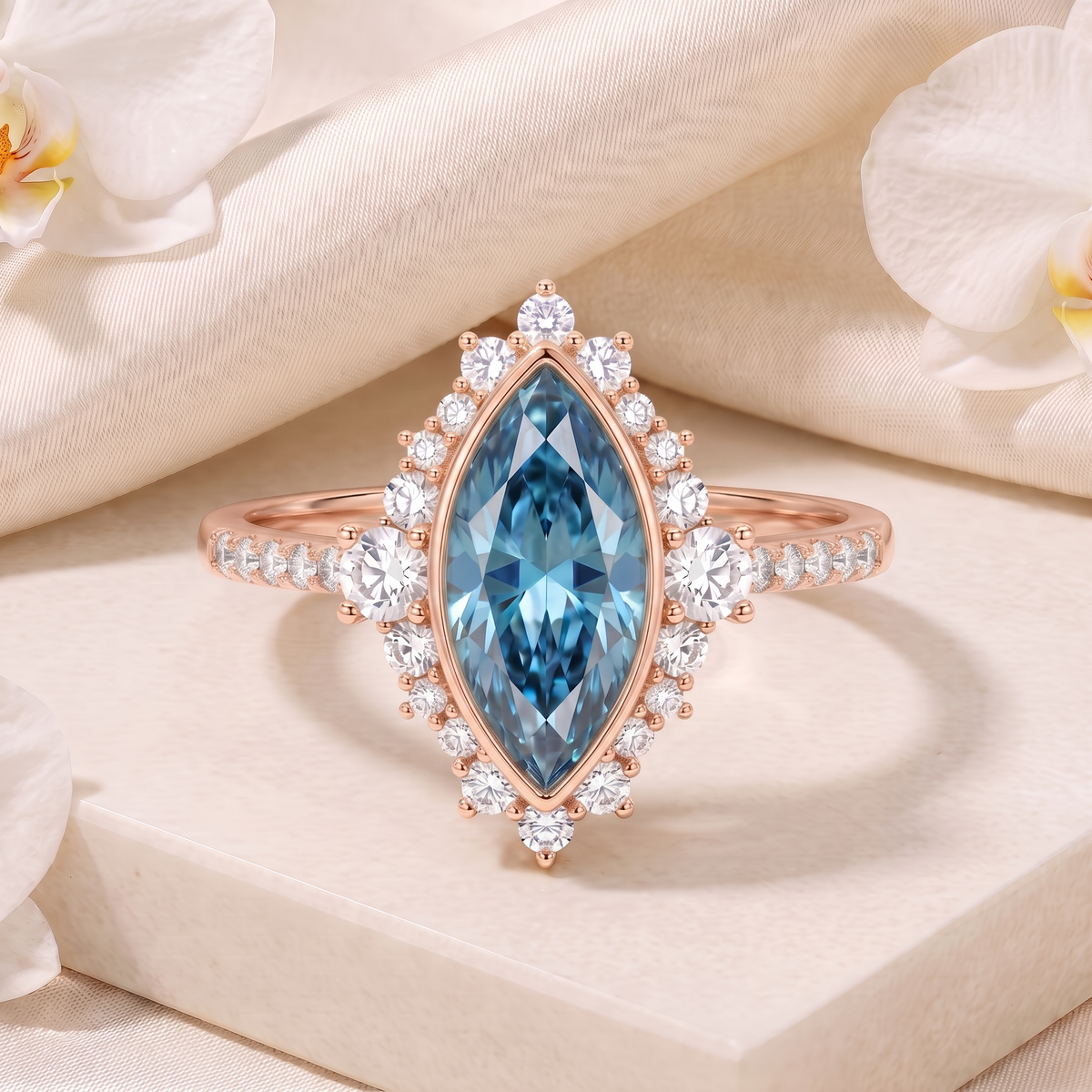 Frontal product view of a marquise-cut blue moissanite vintage halo engagement ring in rose gold.