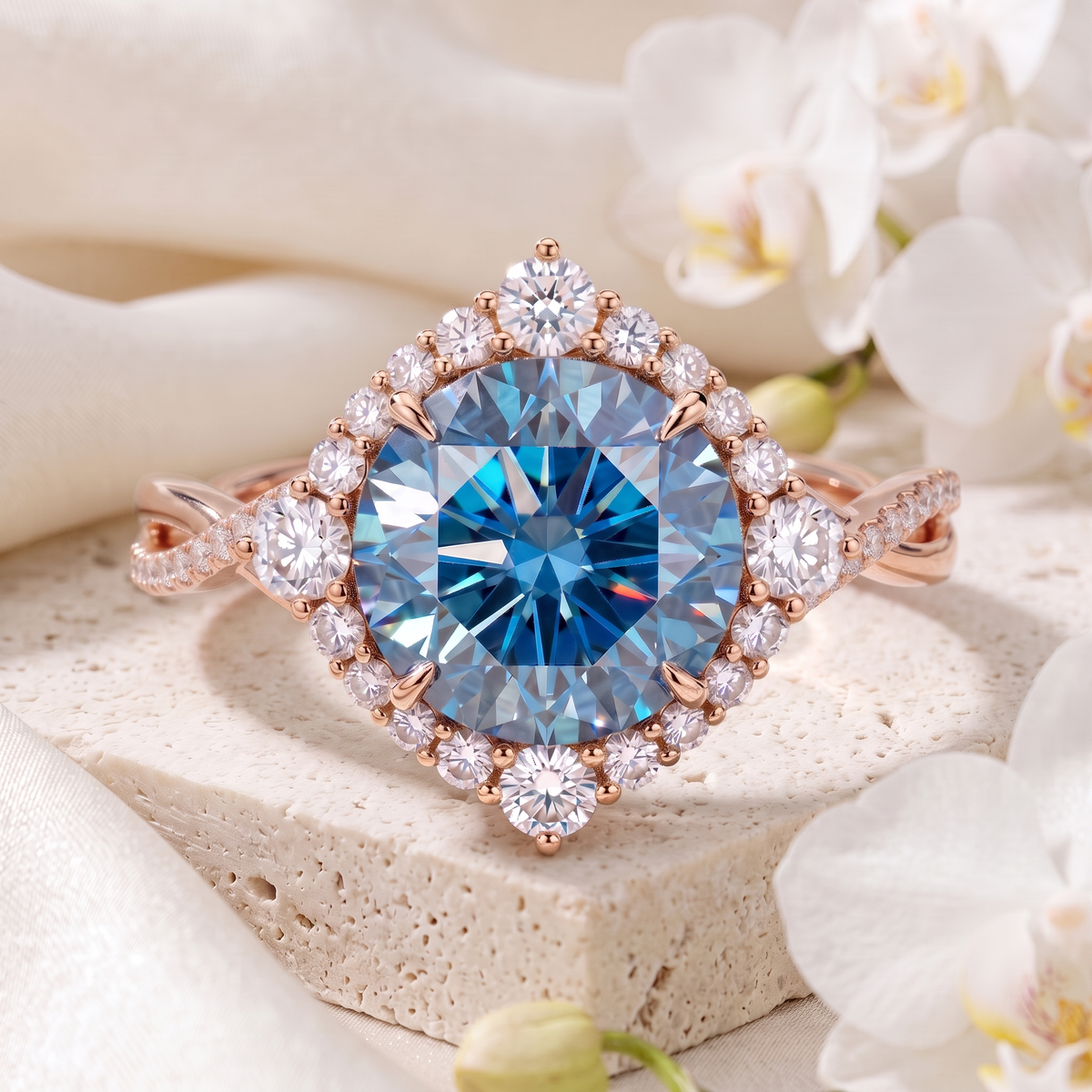 Front view of a round blue moissanite halo ring in rose gold with a twisted pavé band.