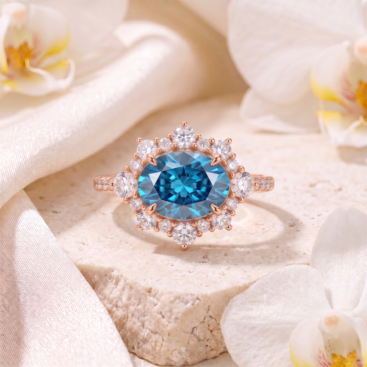 Front view of a rose gold engagement ring with a striking oval blue moissanite center stone and diamond halo.