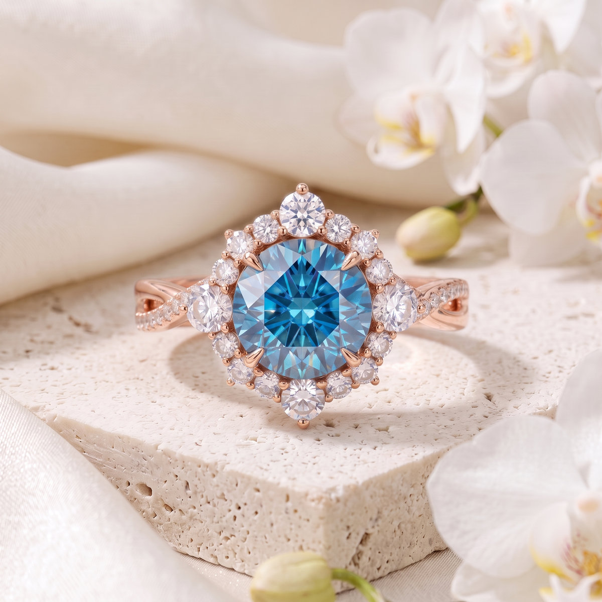 Centered flat-lay of a rose gold halo engagement ring featuring a vivid round blue moissanite center stone.