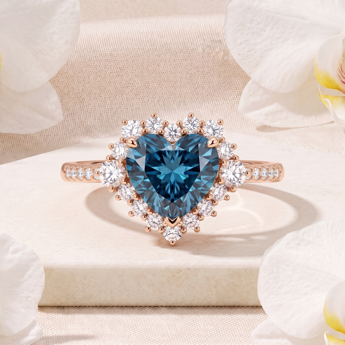 Front view of a rose gold halo ring featuring a heart-cut teal blue moissanite center stone.
