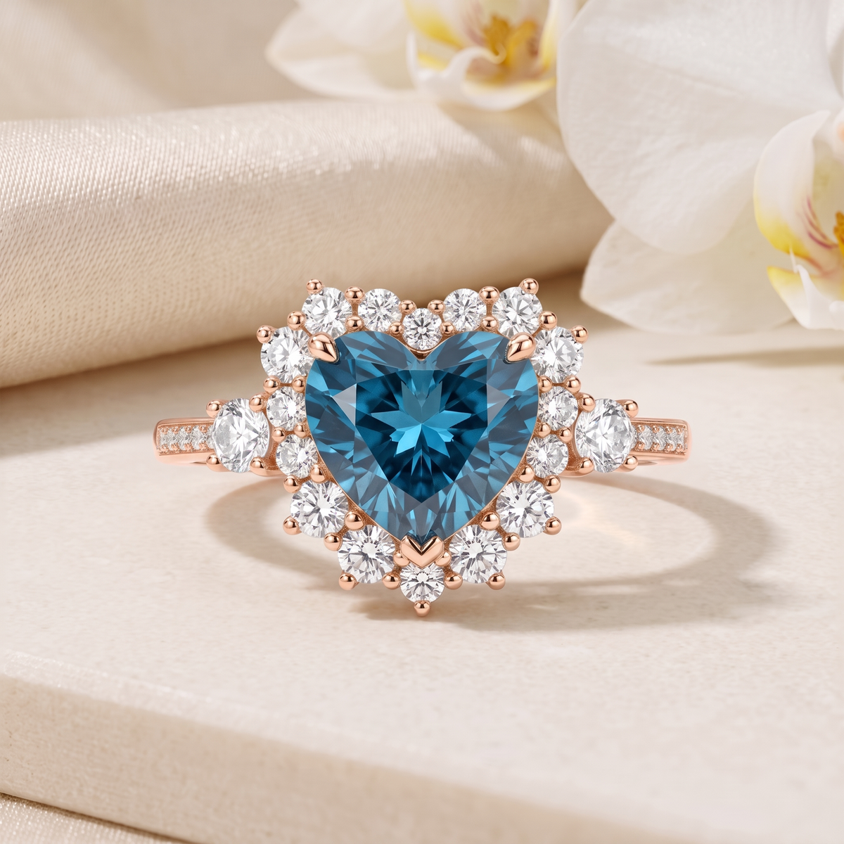 Front view of a heart-shaped blue moissanite halo ring in rose gold.
