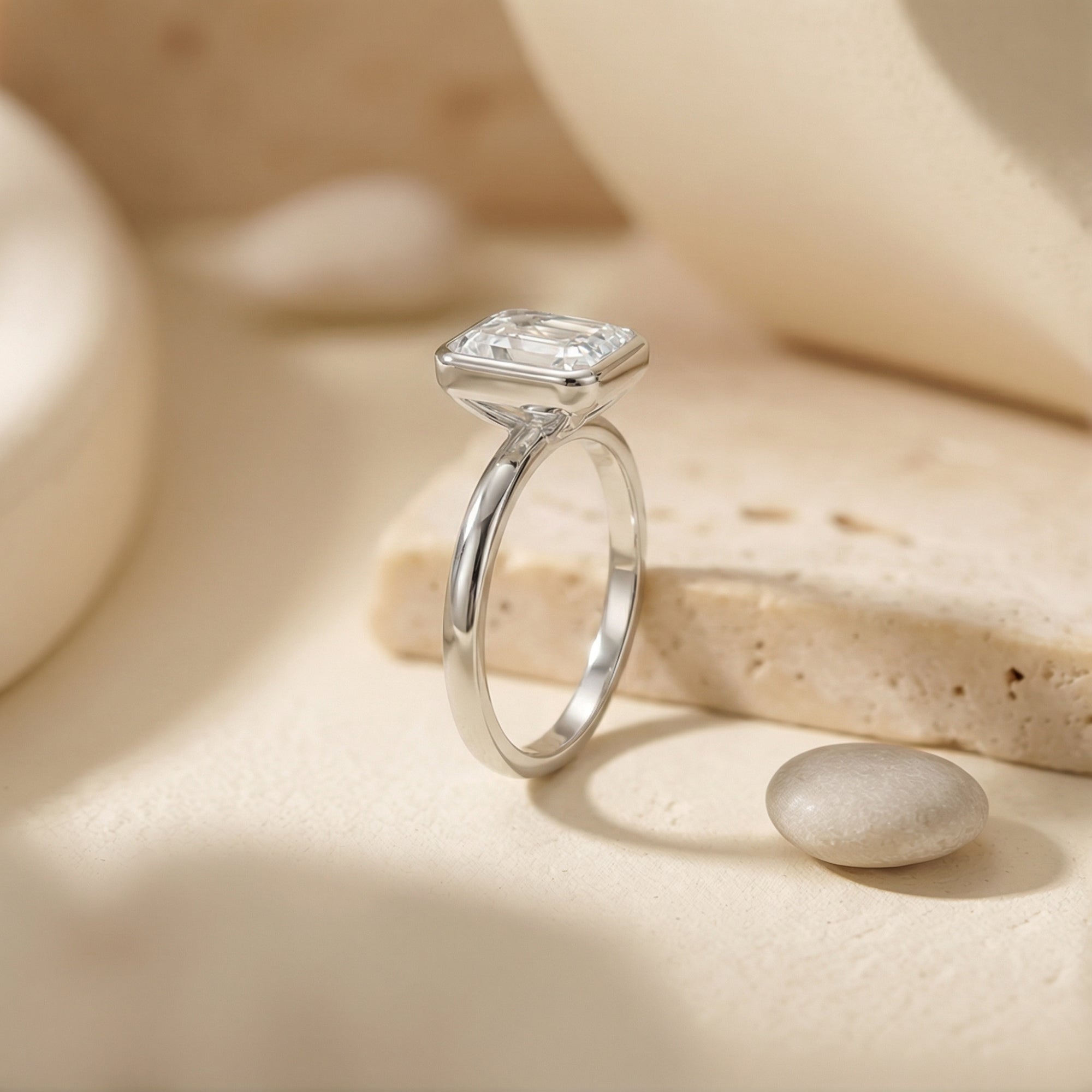 The Astrid Emerald Cut Bezel Ring