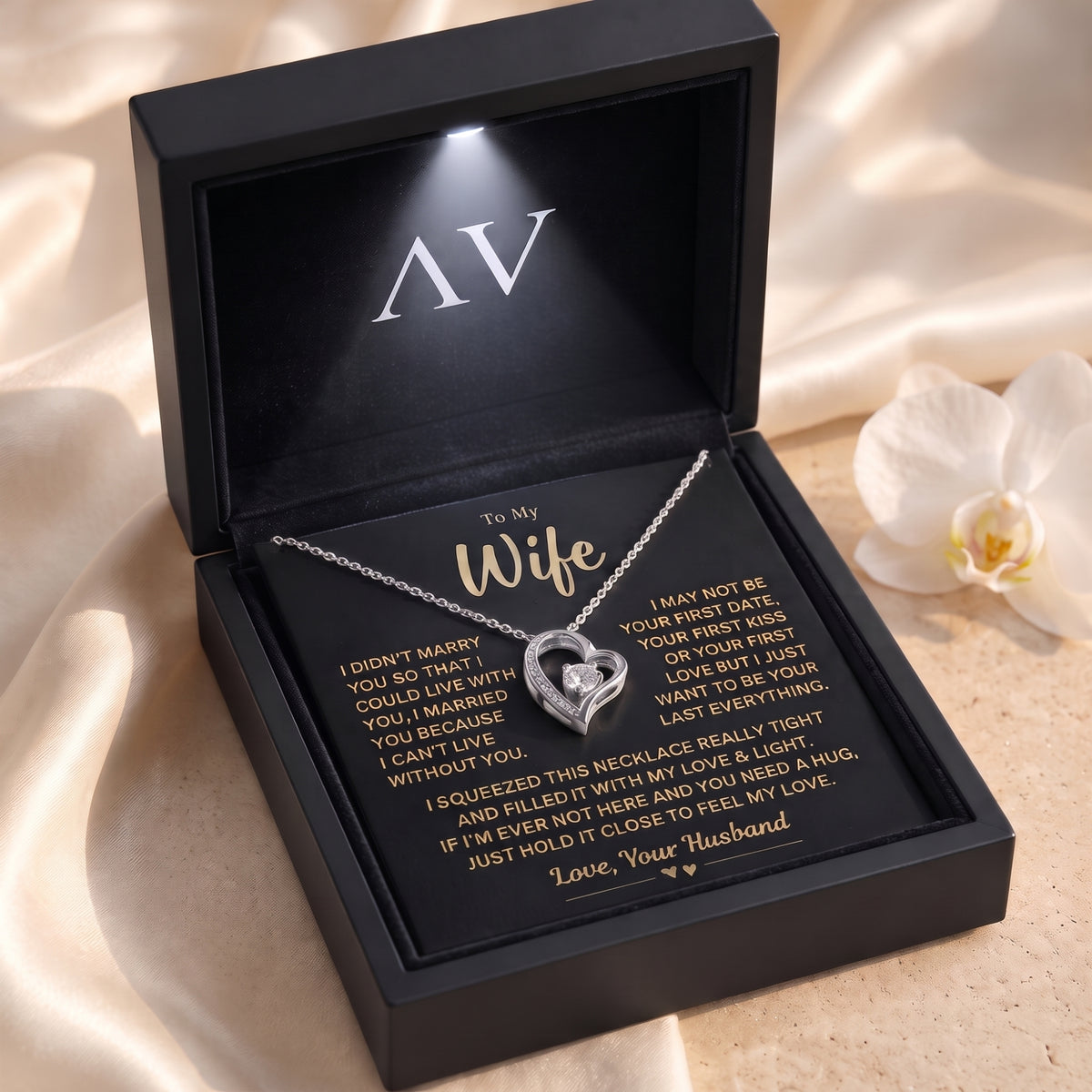 Silver open-heart necklace with Wife message card in black presentation box.