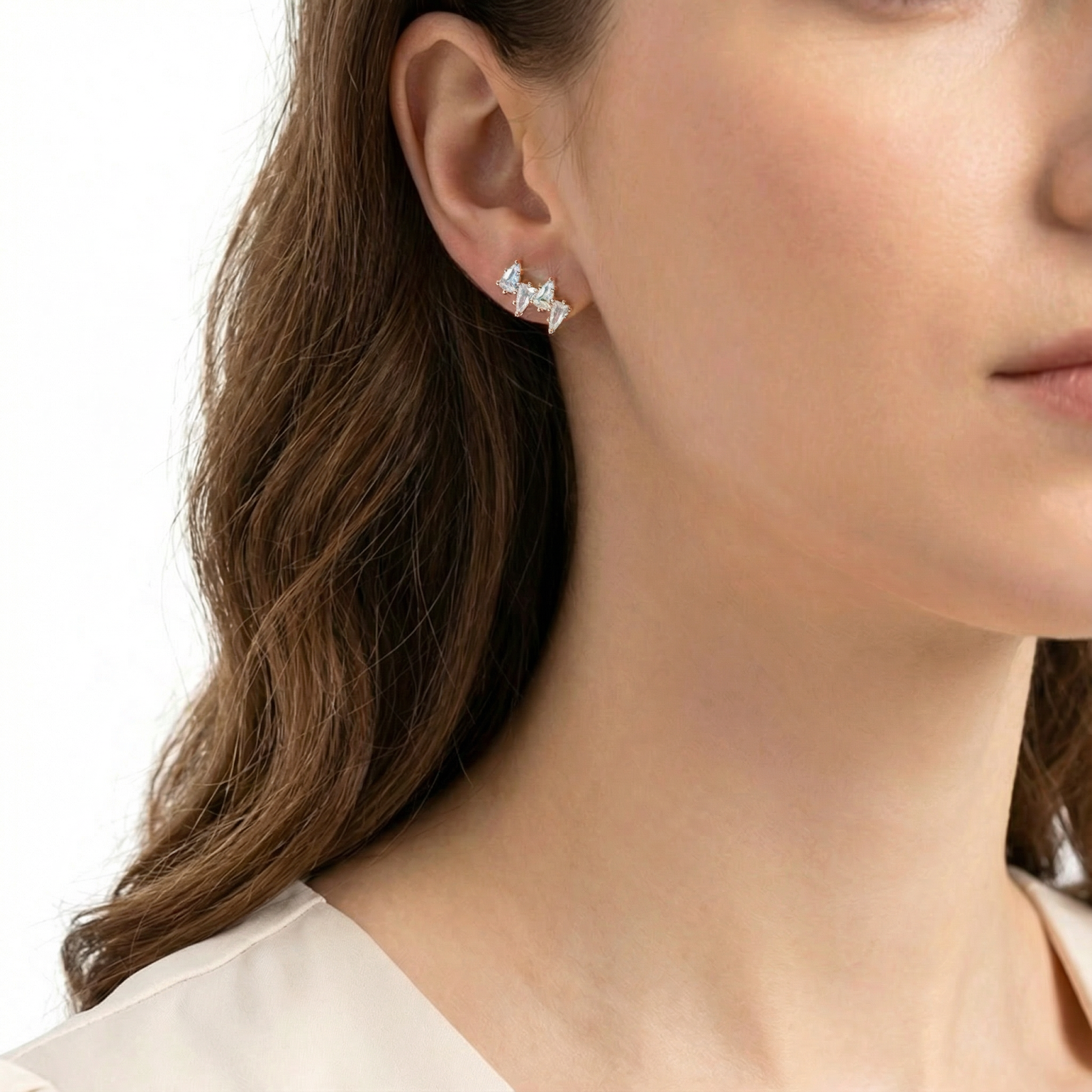 Model wearing an 18K gold vermeil Alizia cluster earring with sparkling April birthstone zirconia.