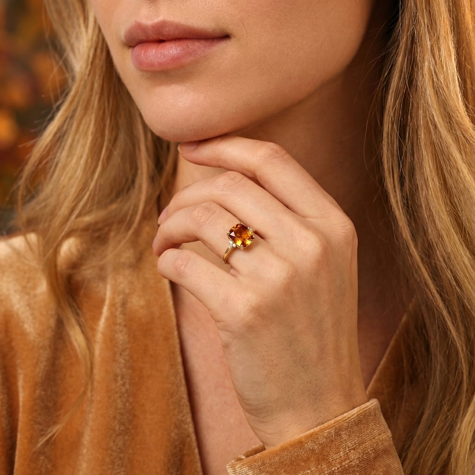 Lifestyle view of a model wearing the 18K gold vermeil cushion-cut simulated topaz birthstone ring.