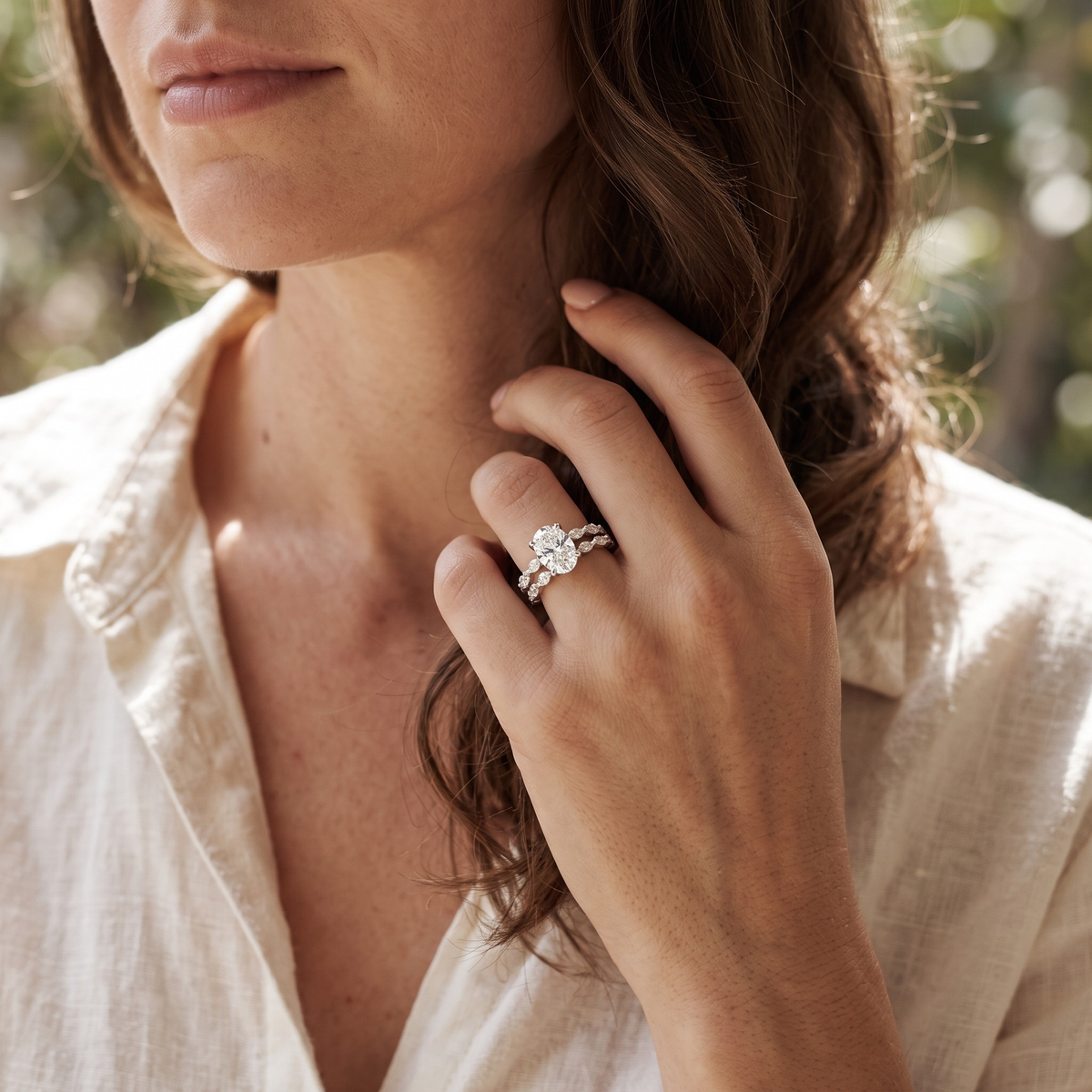 Oval moissanite two-piece ring set in silver, model portrait