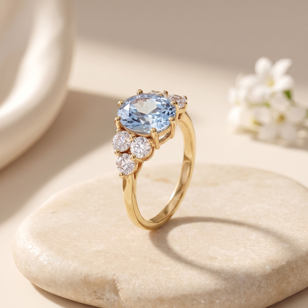 The Fiorella blue oval cluster moissanite ring in yellow gold, isolated product view