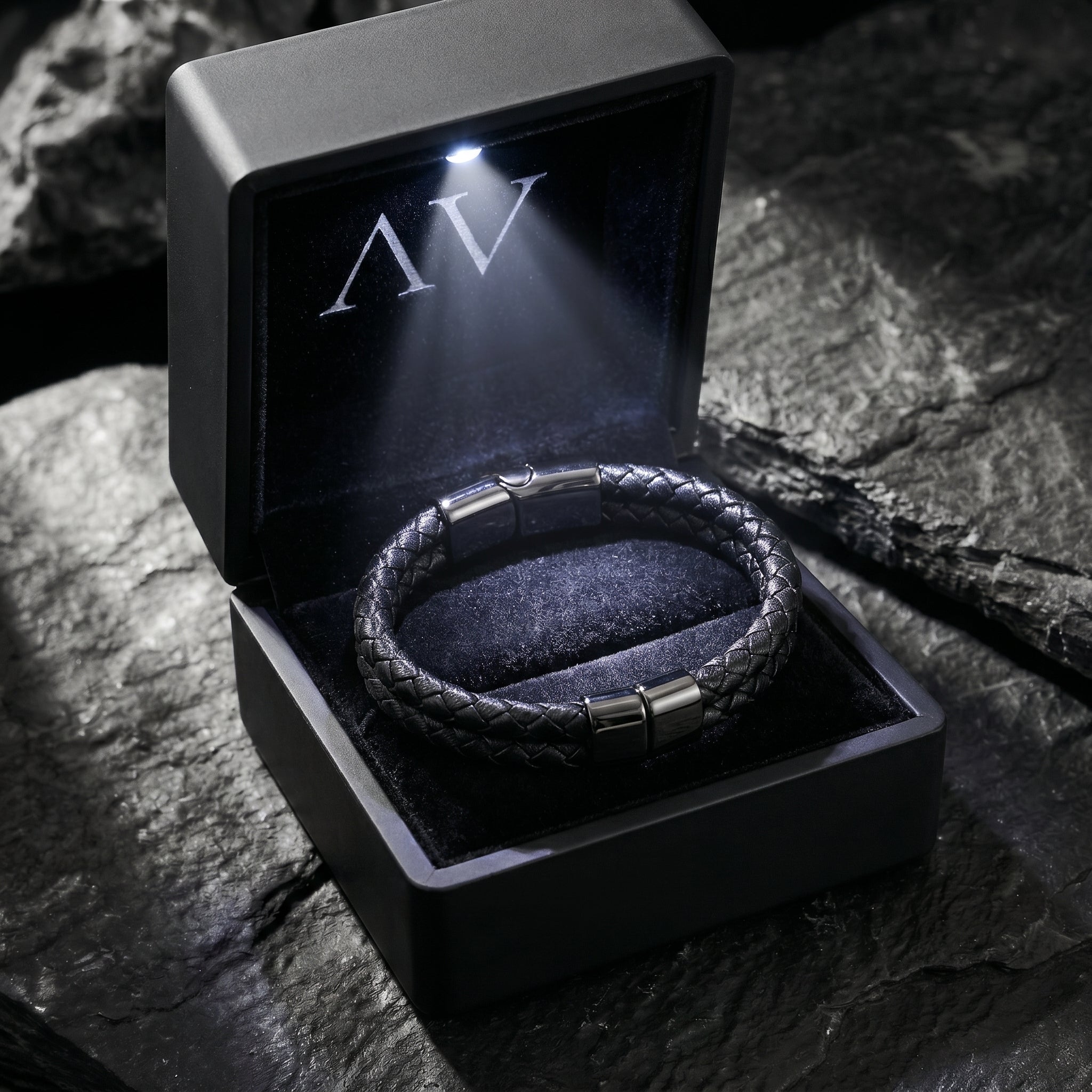 Double-braided black leather bracelet presented in a black illuminated gift box with an LED light.