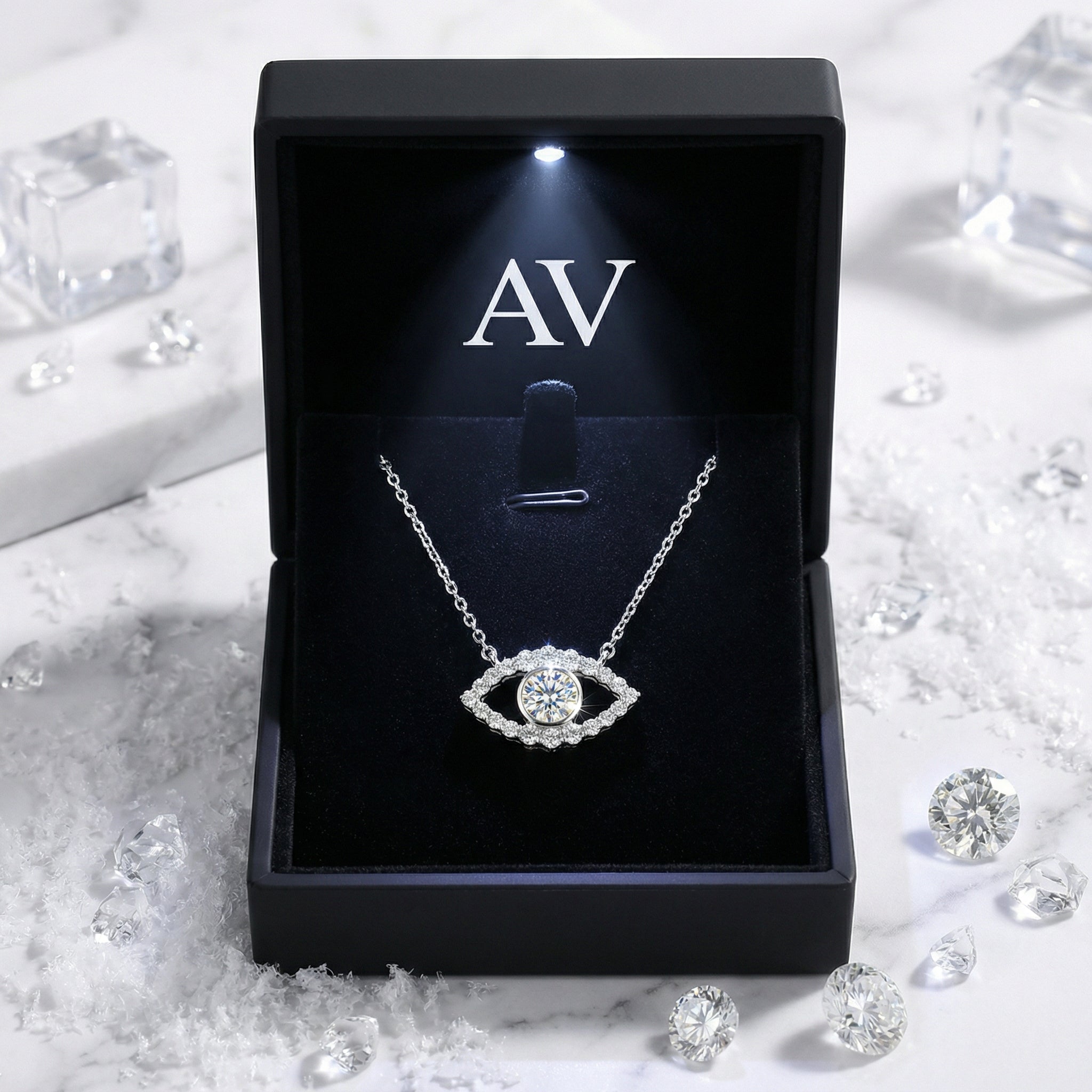 Silver moissanite evil eye necklace presented in a black LED-lit jewelry gift box.