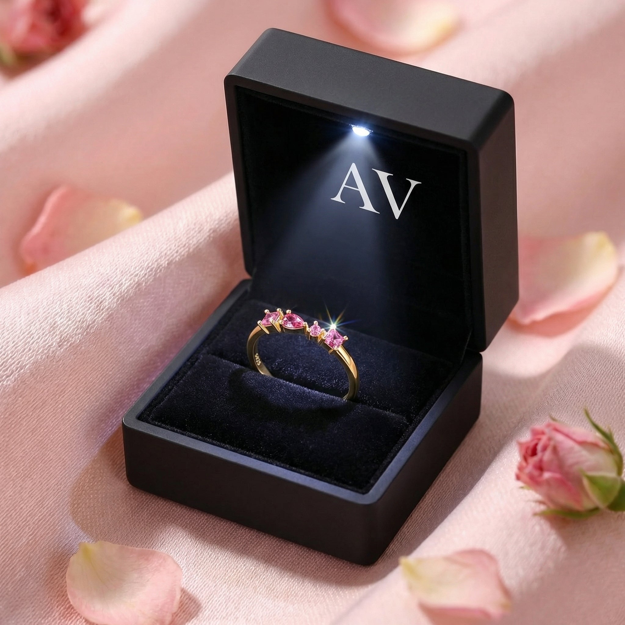 18K gold vermeil pink tourmaline ring in a black LED-lit gift box with AV branding on pink silk.