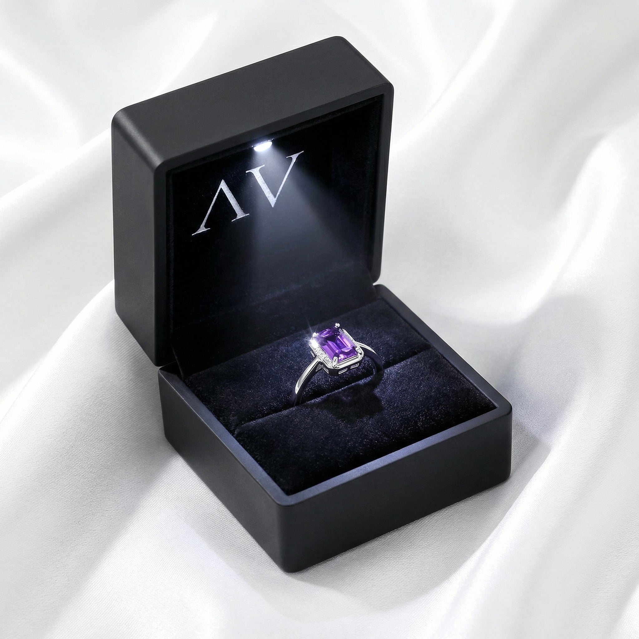 The Valentina emerald cut amethyst sterling silver ring inside a premium black LED lighted presentation box.