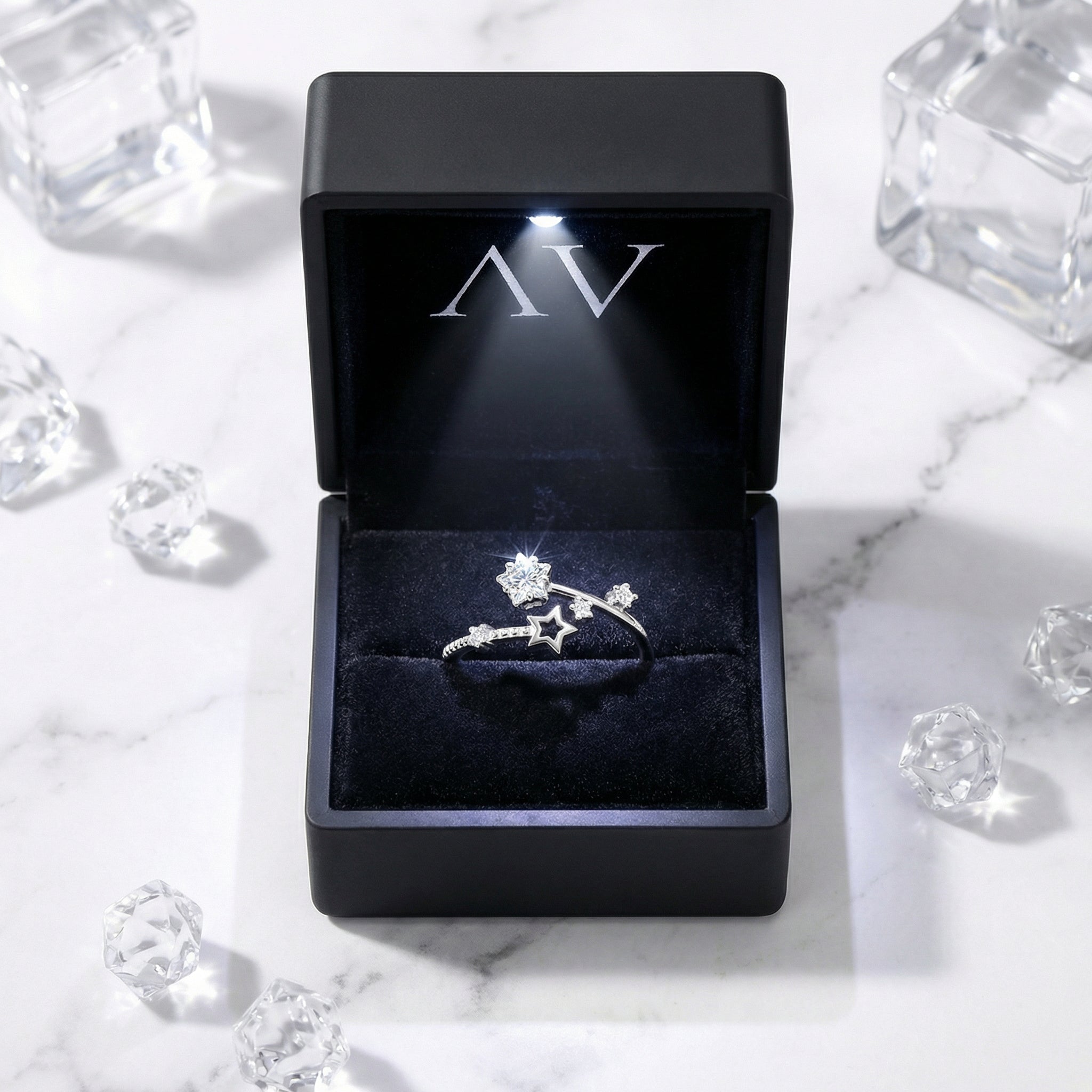S925 sterling silver celestial bypass ring with zirconia stars in a black LED-lit jewelry gift box.