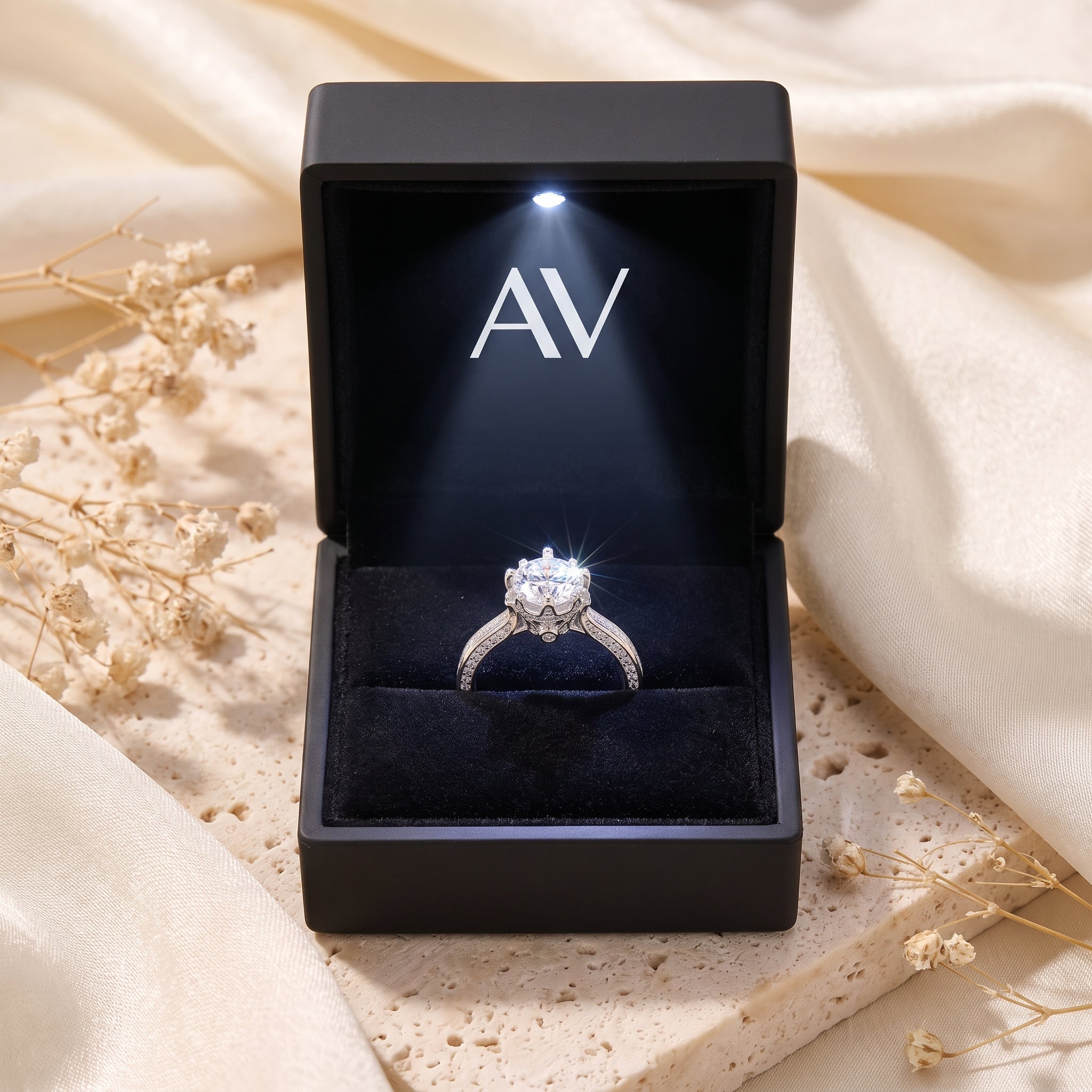 Silver crown cathedral ring displayed in a black LED-lit presentation box.