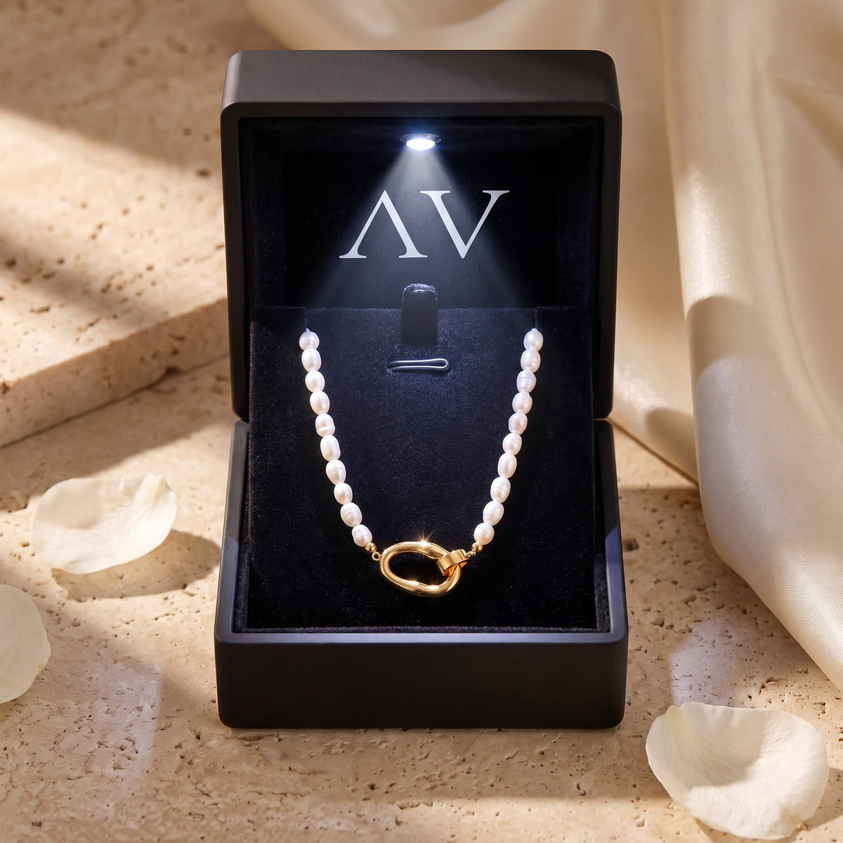 Audrielle 18K gold PVD pearl necklace in black LED-lit gift box.