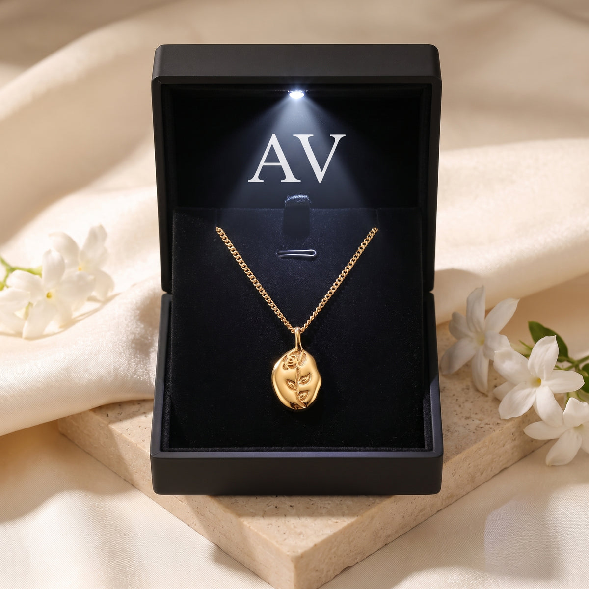 18K gold rose necklace presented in a premium black LED-lit jewelry gift box.