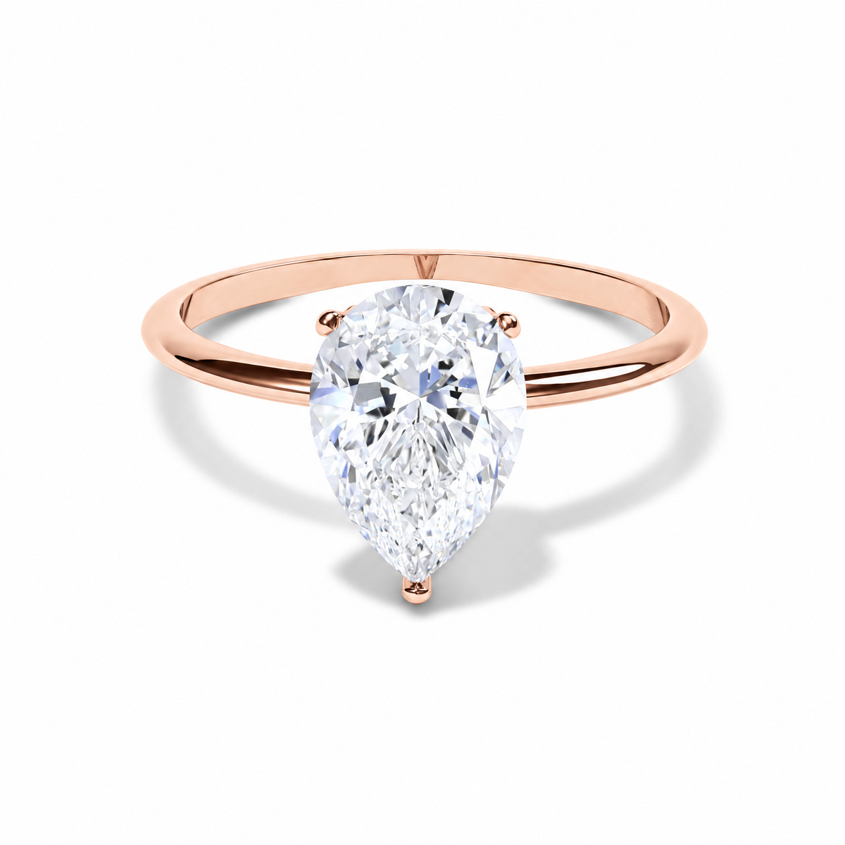 The Ava pear-cut engagement ring in rose gold on a white background.