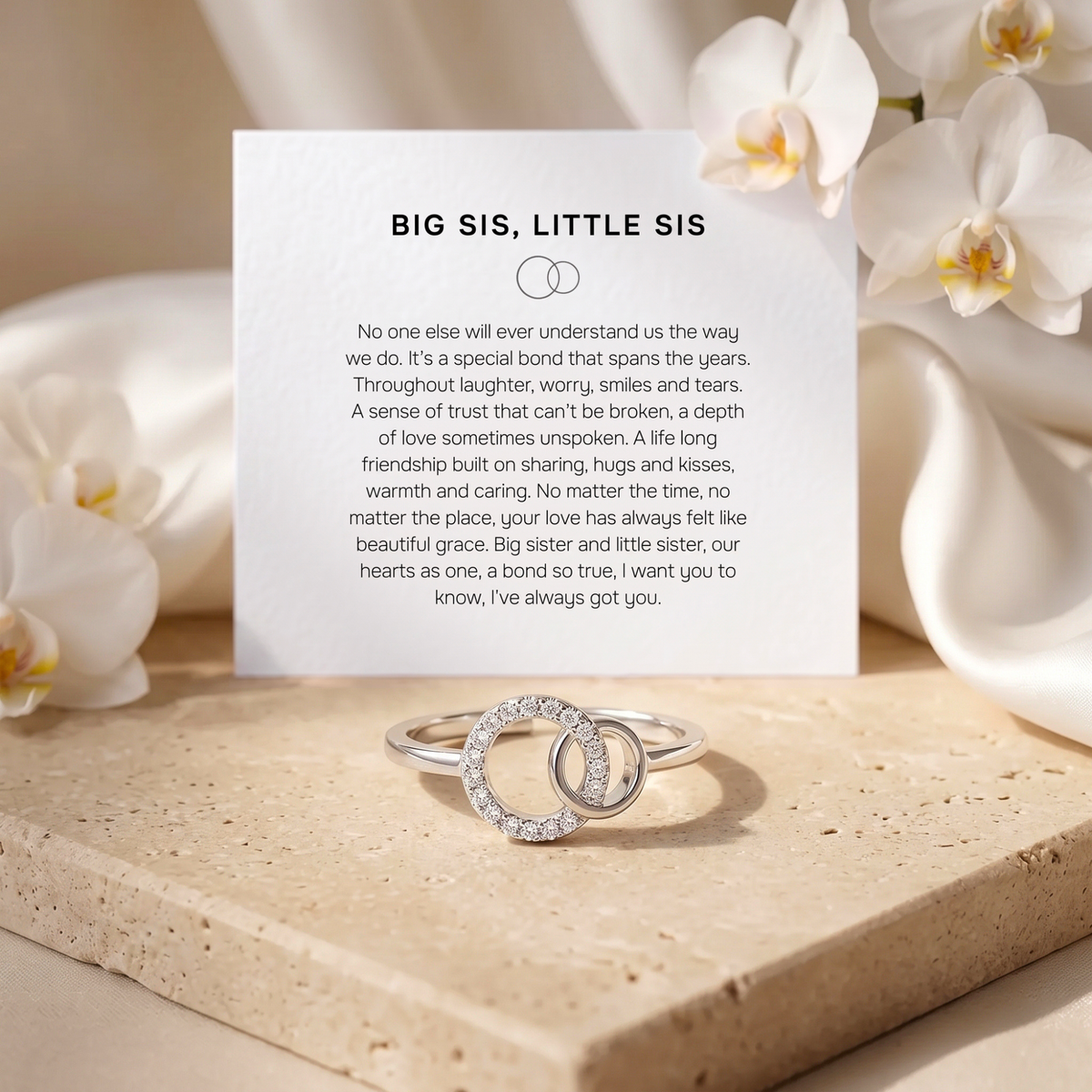 Silver interlocking circle sister ring with the included Big Sis Little Sis message card