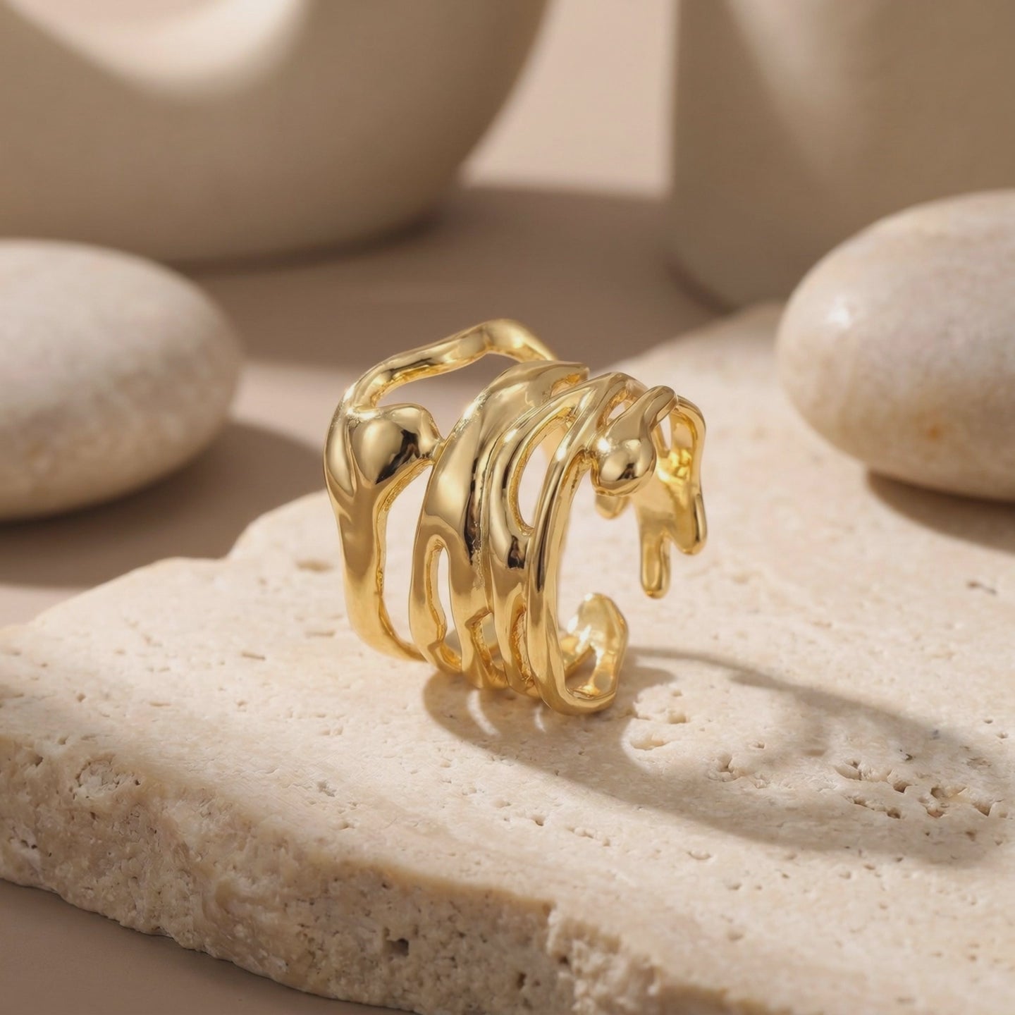 Video of The Marinella Ring, a solid gold ring with an organic fluid design.