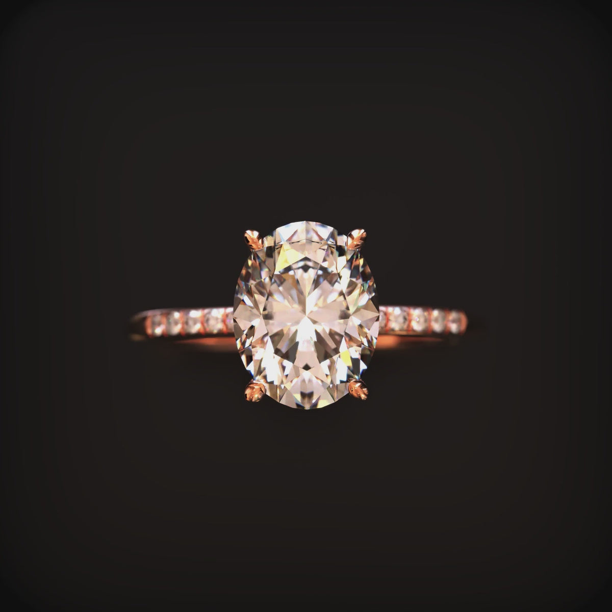Video of an oval moissanite ring in solid gold.