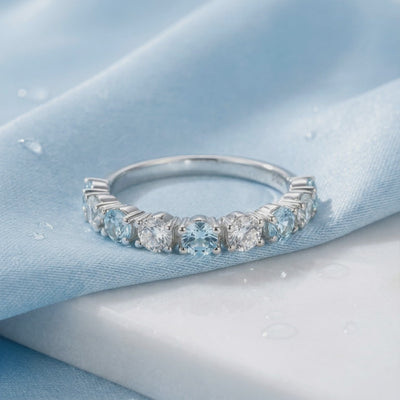 Solid gold ring with simulated aquamarine stones.